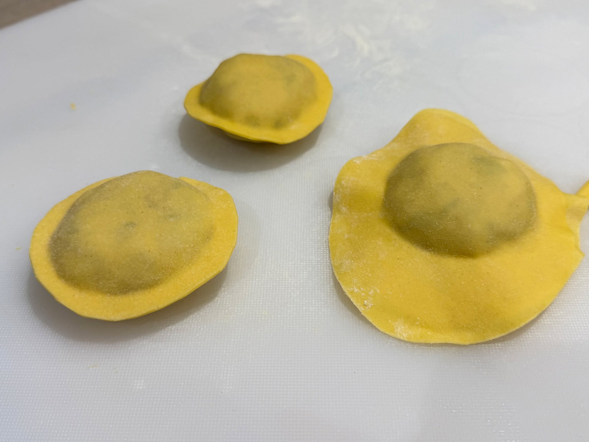 I've mentioned my passion for making pasta before but I just get so excited and proud of my raviolis - they truley are a labour of love.
This was a chicken & lobster ravioli, a 24 hour process.
Chicken thighs are salted down then cooked sous vide for 4 hours, cooled and pulled. The lobster prepped, blanched, cracked and diced. Onion lyonnaise made and chilled to add sweetness, chives chopped then chicken mousse made.
A small amount of the mix is cooked and checked for seasoning and acidity, it is then weighed into 45g balls and chilled overnight.
It is then re-rolled so it is round. Pasta made and the raviolis produced!
#bowlfood #finedining #luxury #passion #reading #buffet #party #oxfordshire #local #privatechef #caterer #bespoke #dinner #wedding #dessert #henley