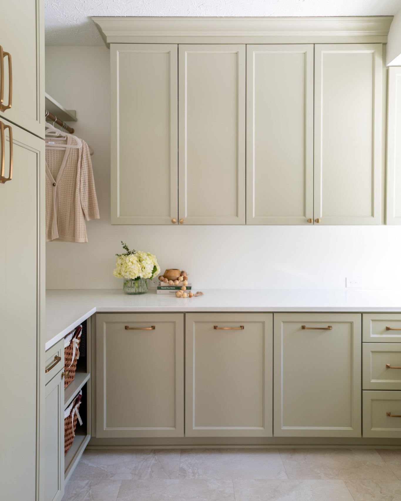 This is what happens when you don’t just “update” a laundry room — you redesign and expand it.
By adding square footage, we were able to:
• Create continuous counter space
• Add full-height cabinetry
• Stack the washer and dryer intentionally
• Improve the flow completely
But here’s what truly changed the feeling of the room…
The softness.
Instead of going bright white or dark and dramatic, we chose a muted, warm green that wraps the room in calm. It’s subtle. It’s quiet. It feels intentional — not sterile.
Laundry may be a task, but the space doesn’t have to feel like one.
When you combine thoughtful layout planning with soft, livable color… even the most utilitarian room becomes beautiful.
Design isn’t just about what you see.
It’s about how a space makes you feel while you’re living in it.
#LaundryRoomRenovation #CustomCabinetry #InteriorDesigner #BeforeAndAfterHome #HomeRemodel #LuxuryHomeDesign #FunctionalLuxury #InteriorDesignStudio #BuiltIns #HomeOrganization #RenovationPlanning #heartfelthomespace