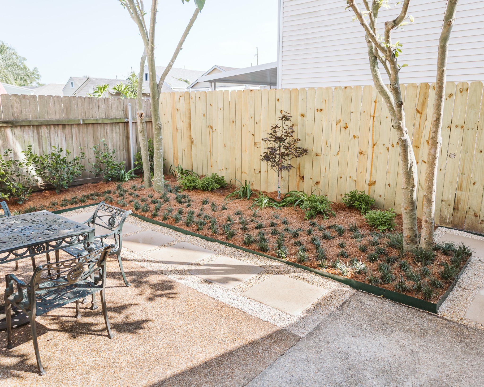 Who says you need grass or turf to have a beautiful backyard? ✨
Clean hardscapes, fresh mulch, and layered greenery create a low-maintenance space that’s just as inviting.
▫️ ▫️ ▫️ ▫️ ▫️ ▫️ ▫️ ▫️ ▫️ ▫️
#thegardengateslandscapecompany #landscape #residential #residentiallandscape #neworleanslandscapes #pavers #thegardengateslandscapecompany #neworleans #metairielandscapes #design #iheartnola #artificialturf #turf #planning