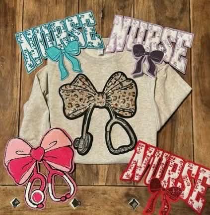 Nurse Life, But Make It Cute Collection
Being a nurse is a calling — but that doesn’t mean you can’t look cute doing it 💖🩺
Our Nurse Life Collection features bold patterned lettering, trendy bows, leopard and checkered prints, glitter-inspired accents, and customizable name options designed for healthcare heroes who love boutique style.
From statement graphic tees to cozy crewnecks, these designs are perfect for:
• Nurse appreciation gifts
• Hospice team wear
• Workday outfits
• Nurse Week celebrations
• Everyday nurse life
Whether you’re in hospice, hospital, clinic, or home health — this collection lets you show up in style while doing what you do best: caring for others.
Because compassion never goes out of fashion.
Exclusive to Not Your Mama’s Boutique.