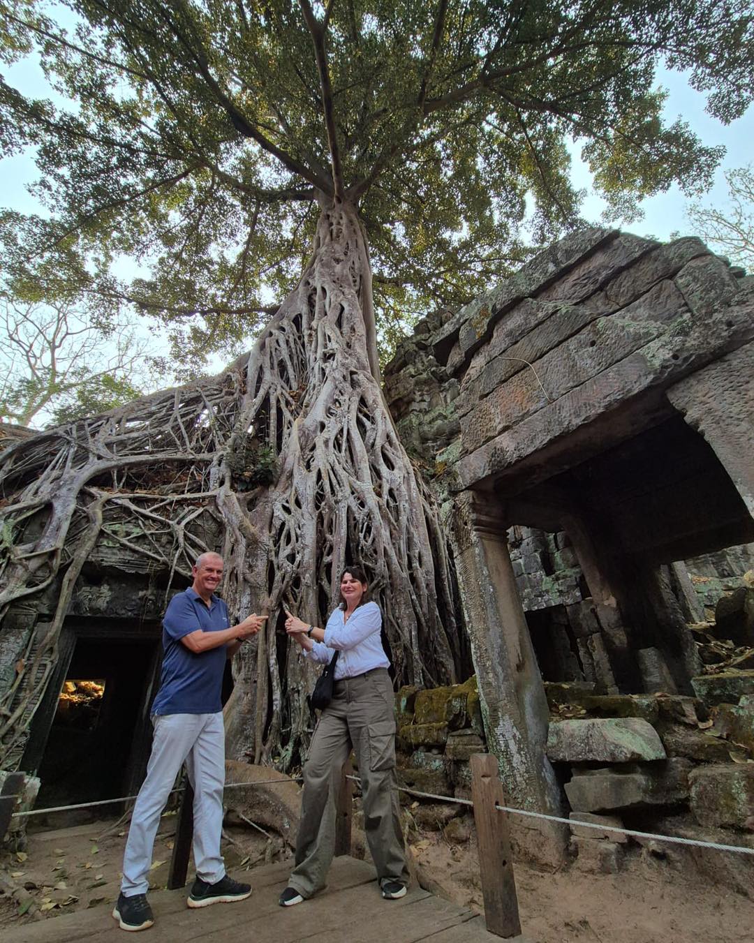 I’ve just received this fabulous photo of Maria & Allan at the Tomb Raider temple (Ta Prohm) along with this lovely message from them 💛
"We are having a fantastic time - this morning was incredible, exploring Angkor Wat and other temples from sunrise with a lovely guide, despite the increasing heat (real feel 41C today😯).
Went to Pub St this eve and found a great restaurant with bargain cocktails there too. Prices out here are amazing aren’t they! Hope Vietnam is just as good as Cambodia!"
It sounds like they’re having the trip of a lifetime already! 🌏