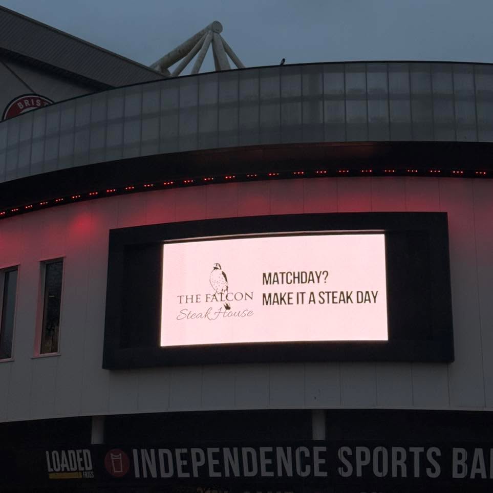Last night was the match we proudly sponsored — Bristol City vs Watford at Ashton Gate. As a business, we’ve never done anything like this… and what an experience it was.
Hearing The Falcon Steakhouse announced over the stadium PA and seeing our branding up on the big screens was honestly a bit of a pinch-me moment. A proper dream come true for a small independent business from Wotton.
The only downside? The result. But being a season ticket holder since I was 7, I’m a little used to that by now
The hospitality at Ashton Gate was absolutely spot on — great service, great food, looked after from start to finish. But the highlight has to be walking out onto the pitch during the warm-up with the first team. That’s something I won’t forget in a hurry.
And… we only went and won the quiz… again. (That’s four in a row!)
Massive thank you to everyone involved in making it such a special evening. Hopefully we reached a new audience and gain some new customers off the back of it. Because once we get someone through the door, we do everything we can — through our service and our food — to make sure they come back for years.
It was 20 years ago that I came up with our company motto, our mission statement:
Enter as a customer, leave as a local.
That one sentence is the cornerstone of The Falcon Steakhouse. It’s at the front of our minds in every decision we make and every action we take.
Special mention to Phil for pulling together all the artwork for the advertising — top job as always 👏
Andy x