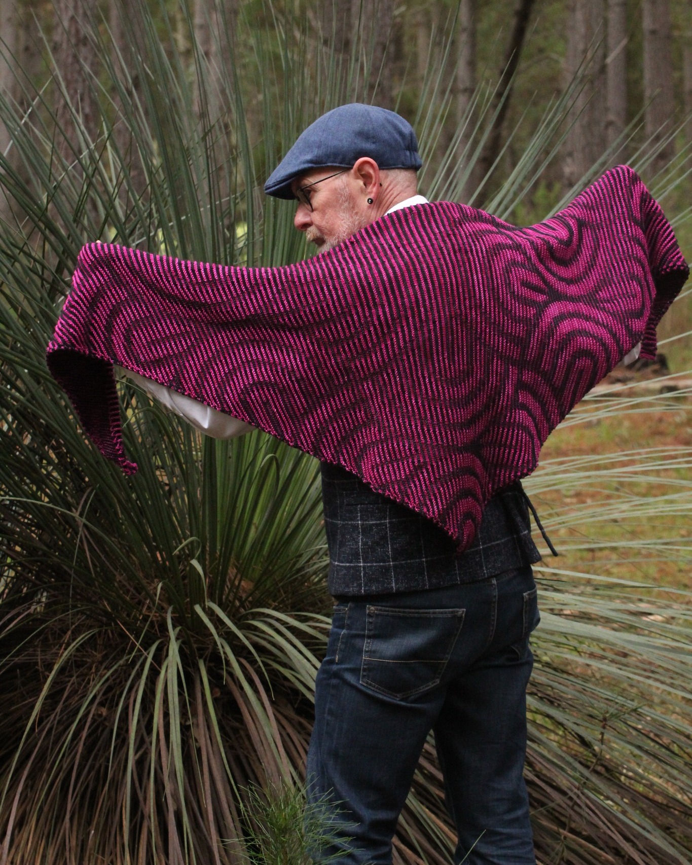 We are thrilled to welcome Jamo back to the Australian Yarn Show, especially with his two Shadow Knitting workshops which have officially SOLD OUT! 🎉
Jamo began knitting during a period of illness, when a friend taught him the basics while he recovered. What started as a quiet pastime quickly became a daily passion, and eventually, Jamo Designs was born 🌟
Now recognised across Australia and internationally for his striking shadow knitting patterns, Jamo is known for transforming what looks complex into something surprisingly achievable. His designs, including fan-favourite shadow shawls like the rose, wolf and sugar-skulls, have often been inspired by requests from his own community 🫶
Beyond designing, Jamo is deeply motivated by the yarn community, seeing others interpret his patterns in new colours and yarn choices is what fuels his creativity. He is also known for offering detailed advice on colour selection and yarn pairing, ensuring makers feel fully supported in their projects 🧶
We’re so proud to have Jamo sharing his expertise with us again this year. If you’ve secured a spot in one of his workshops, you’re in for something special ✨