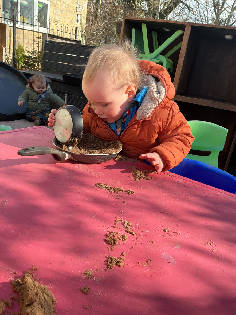 Some of our babies enjoying a little outdoor kitchen play 🧑🍳
With sand, pots, pans and plenty of imagination, the babies were busy mixing, scooping, pouring and experimenting together.
Open-ended resources like these allow children to lead their own play. There’s no 'right' way to use them, which encourages creativity, problem solving and lots of sensory exploration.
Outdoor play offers babies so many opportunities to explore different textures, sounds and movements while enjoying fresh air and space to discover at their own pace.
#hyggeintheearlyyears #earlylearning #outdoorplay #OutdoorLearning