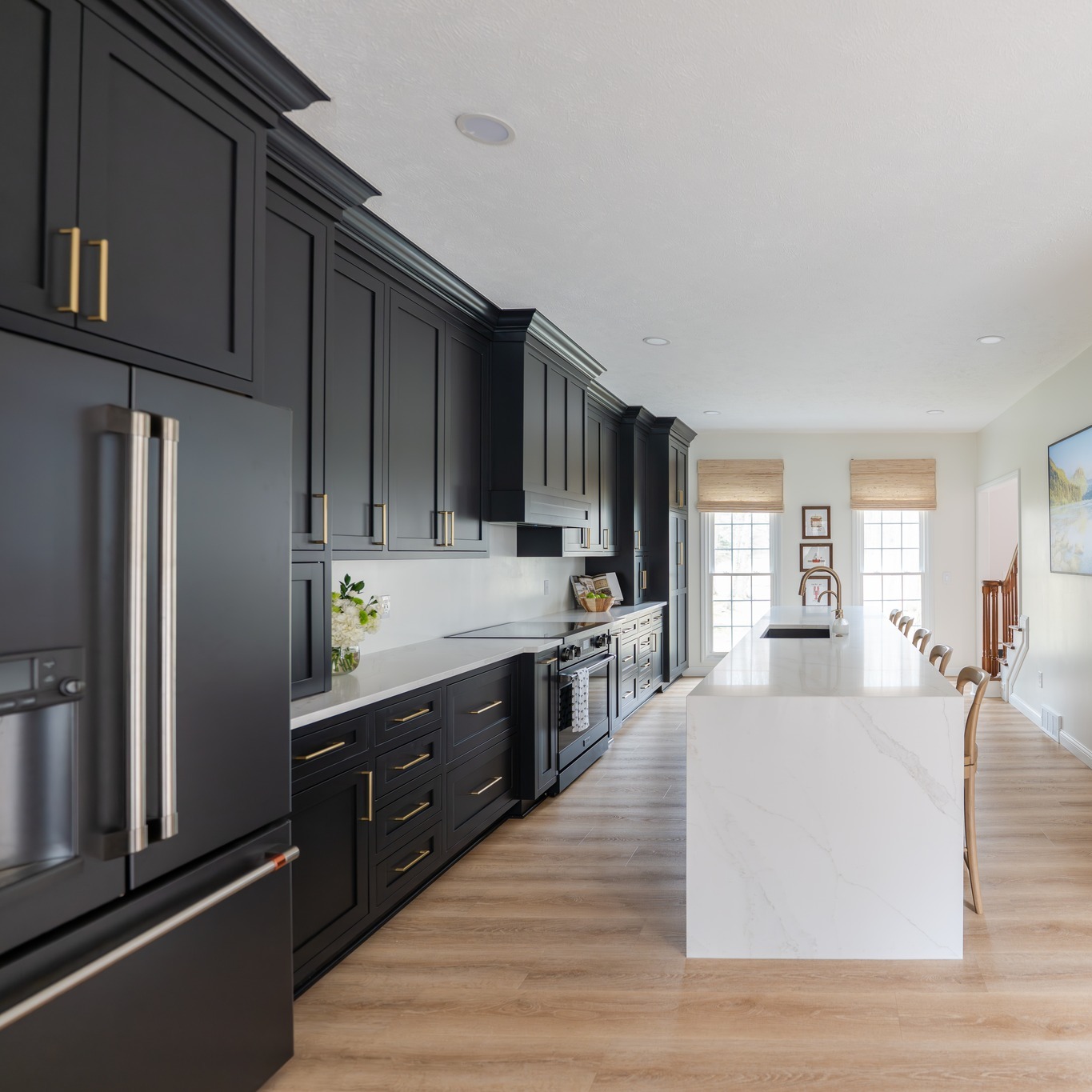 I've been WAITING for what feels like forever to share these photos.
✨ BEFORE → AFTER KITCHEN TRANSFORMATION ✨
This kitchen went from closed-in and dated to open, bright, sleek and incredibly functional.
The original layout had a bulky raised bar, limited workspace, and a lot of visual weight from the cabinetry. By rethinking the layout and simplifying the lines, we were able to completely transform how the space feels and functions.
What changed:
- the peninsula bar counter was replaced with a large oversized island
- The wall between the scarcely used dining room and kitchen was removed to create a larger open space
- new flooring throughout the entire main level floor
- Natural lighting flows from the front of the house to the back
- Counter prep space and storage increased significantly
The biggest transformation isn’t just the finishes — it’s how much larger and more connected the kitchen now feels.
Proof that thoughtful design can completely change how a home lives. 🤍
Which do you love most — the dramatic cabinetry or the oversized island?
#kitchenbeforeandafter #kitchenremodel #kitchenreveal #interiordesign #kitchendesign #modernkitchen #homebeforeandafter #remodelinspiration #customkitchen #kitchenisland #designmatters #interiordesignerlife #luxuryinteriors #homerenovation #kitcheninspo
