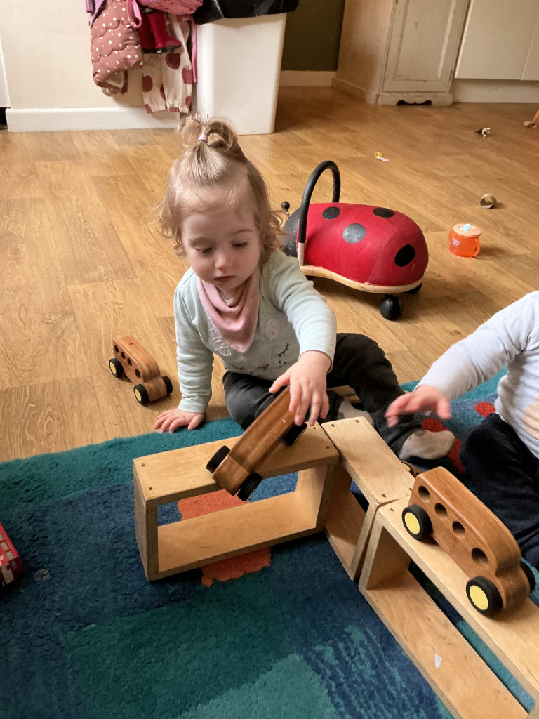 Today’s play was led entirely by the children’s imagination 🚗
Using blocks, the babies began creating ramps and pathways for their cars, experimenting with height, balance and movement.
Resources like wooden blocks are wonderful because they have no single purpose. They can become towers, roads, houses, ramps or anything else children imagine.
This kind of open-ended play encourages creativity, problem solving and early engineering thinking, all while allowing children to lead their own learning and exploration.
#earlylearning #hyggeintheearlyyears #sharingiscaring #openendedplay #openendedlearning
