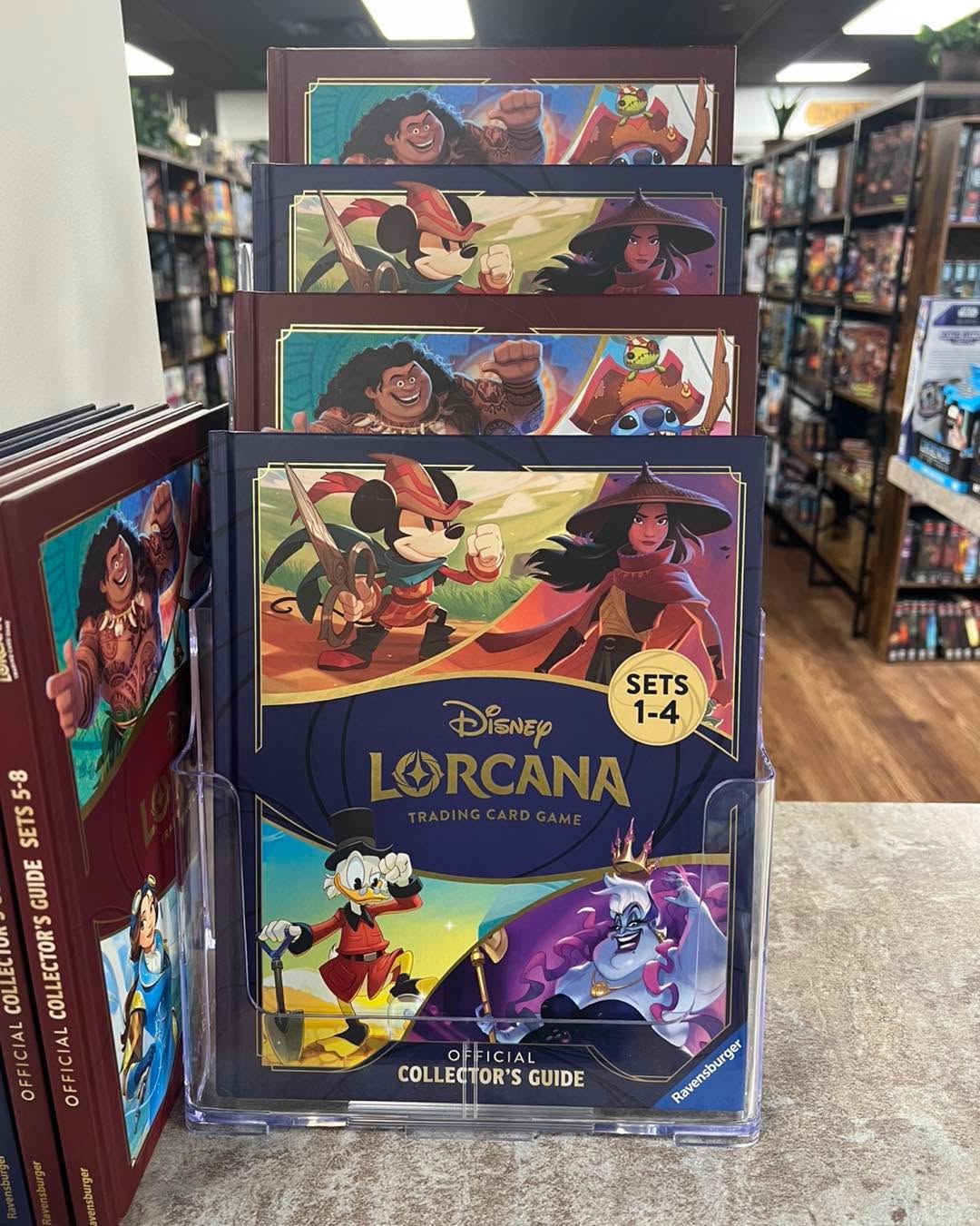 Hey Illumineers come see us here at ROUNDTABLE GAMES and pick up your copies of the Lorcana collectors guides. Come see all the cards and stories that have come from Lorcana since the beginning. We look forward to seeing you soon and showing you the ROUNDTABLE DIFFERENCE!