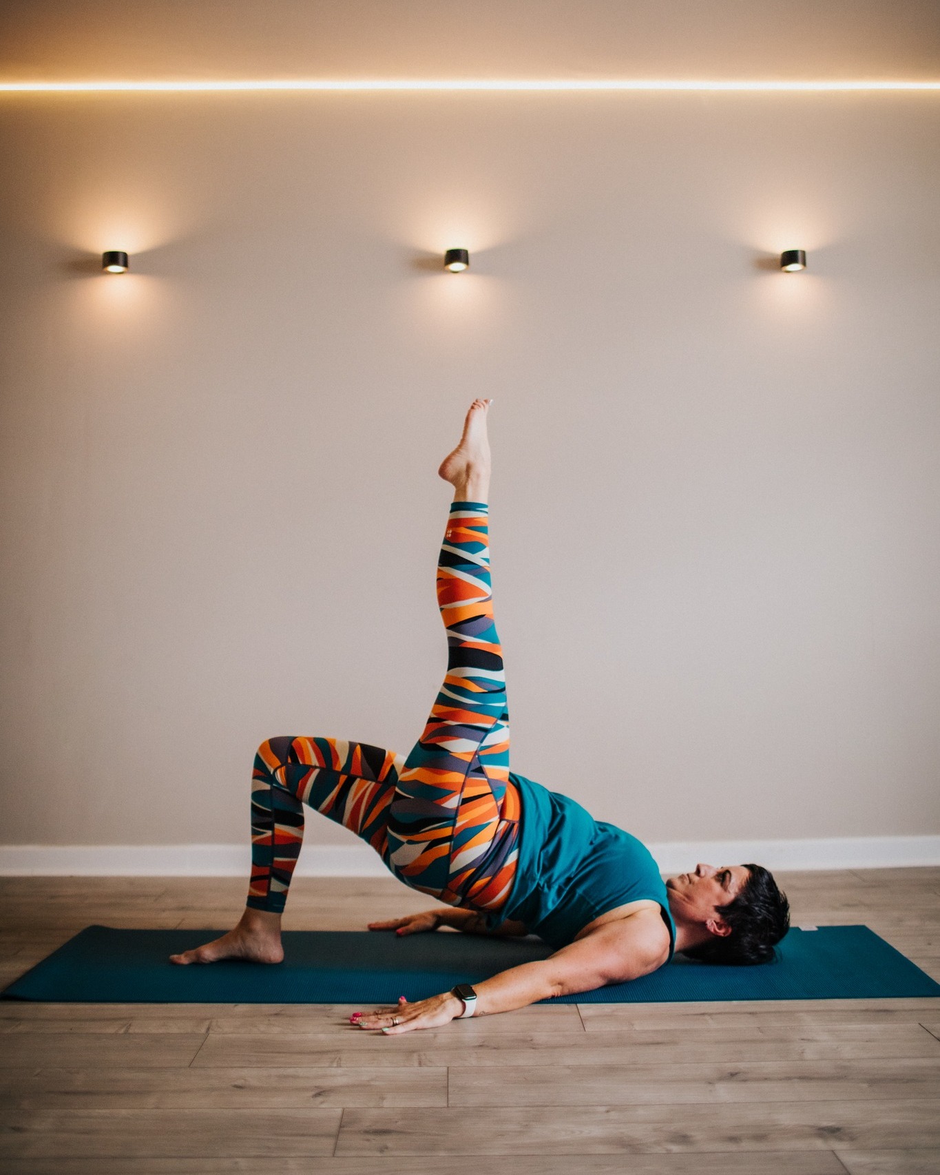 Day 17 - Shoulder Bridge
Exercise 18/34
Shoulder bridge is always a good one to light up a light bulb inside clients heads and really get them to āfeelā what is going on in their body.
Often in class I talk about thinking of your body like a hammock. If you think about the structure of a hammock it has two points that are pulled in opposing directions to create stabilityā¦..right?
If we translate that to the body and think about our knees and crown of our head being those two points, one of the keys to stability in the shoulder bridge is looking for length through these rather than just squeezing the glutes and lifting! The traditional Return to Life version also has the hands supporting the hips to help find a deeper extension through the spine. Find even more lift by reaching the toes to the ceiling.
Looking at the apparatus - we can work on building the strength and length for this with Side Leg Kicks on the Cadi/Tower or our Tree on the Reformer.
šš»
#marchmatness #marchmatness2026 #pilates #pilatesmat #controlology #returntolife