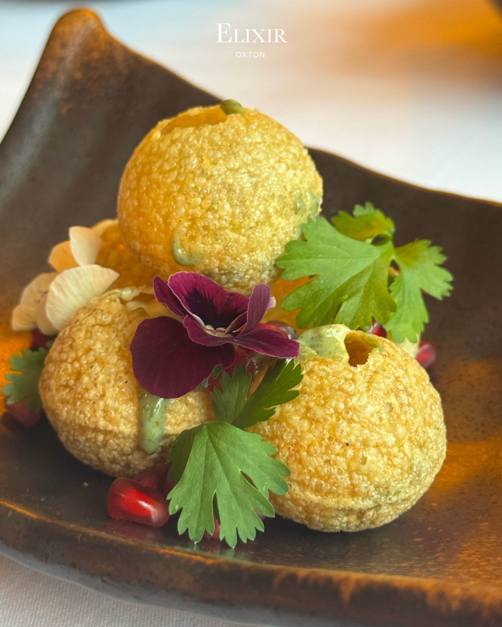 New Menu Item: 𝙀𝙡𝙞𝙭𝙞𝙧’𝙨 𝘾𝙝𝙖𝙖𝙩 𝘽𝙤𝙢𝙗 💣
Delicately crisp bread puffs filled with chickpeas, spiced yogurt, tamarind and coriander - balance of sweet, sour and savoury!
Come & try and let us know what you think!
#ElixirOxton #DrinkInStyle #Cocktails #Wirral #Food #newmenu #foodie #Restaurant #Elixir #WirralRestaurant #elixir #wirral #restaurant #ElixirWirral