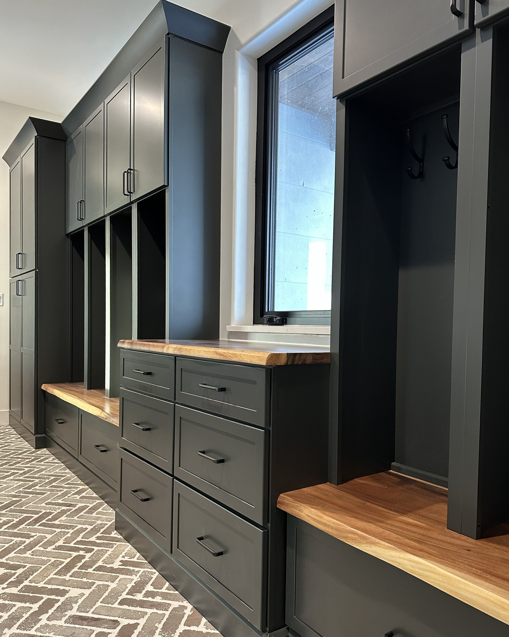This mudroom is so beautiful, you might actually leave the mud at the door! 🚪
Rich charcoal cabinetry brings depth and style, topped with warm custom wood surfaces that elevate the entire space. A brick herringbone tile adds just the right amount of visual interest, creating a look that’s both timeless and refined.
Not pictured: Individual outlets in each cubby to keep everyone’s personal devices charged and ready to go! 📱
Cabinetry Design by @anniemillerdesigns
Cabinetry by @wwwoodproducts
#mudroom #cincinnatidesign #cincinnatidesigner #cabinetrydesign #aplaceforyourstuff