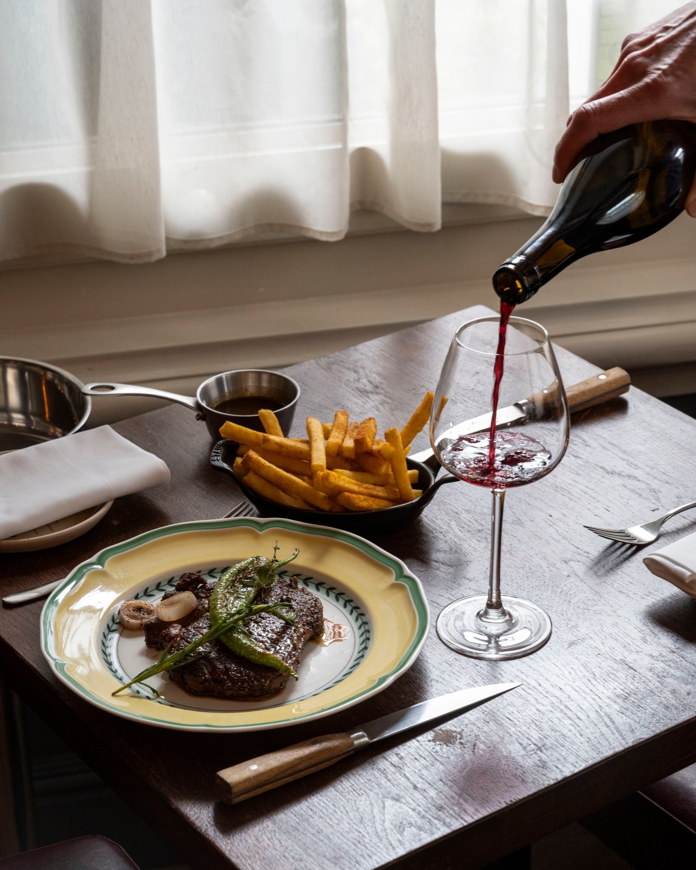 Join us on Friday, 27th March, as a true brasserie classic returns. 🇫🇷🥂
Begin with a mixed green garden salad, followed by steak frites with your choice of sauce - Béarnaise, Peppercorn or Café de Paris, and finish with either a classic tarte aux pommes fines or baba au rhum.
Reserve your table now, seats are limited. À bientôt! ✨