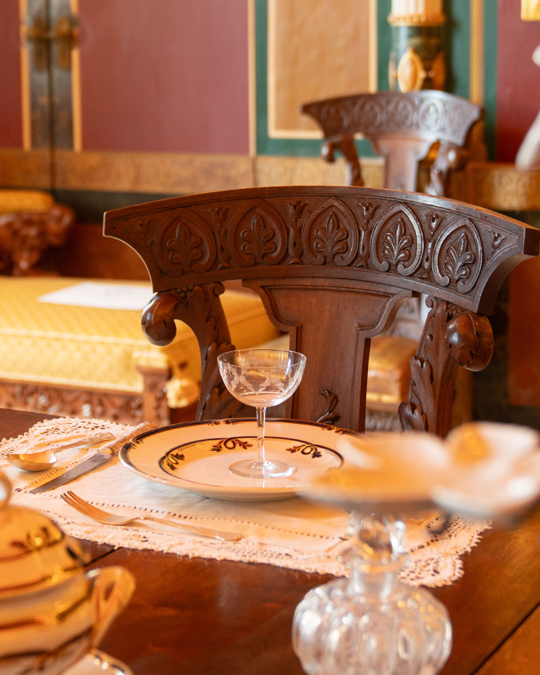 Giuseppe Scicluna didn't just want Pompeian-inspired décor. He wanted the real thing.
So when his architect, Annibale Lupi, wrote from Pompeii saying he'd found a complete set of furniture in the exact style they needed, Giuseppe bought it on the spot. The carved motifs - acanthus leaves, classical flourishes - echo the wall paintings and stucco work Venuti created.
Stand in this room and everything speaks the same language: furniture, frescoes, floor, ornaments. It's the level of obsessive attention that makes a room feel complete rather than assembled. Most people don't notice. But once you do, you can't unsee it.
