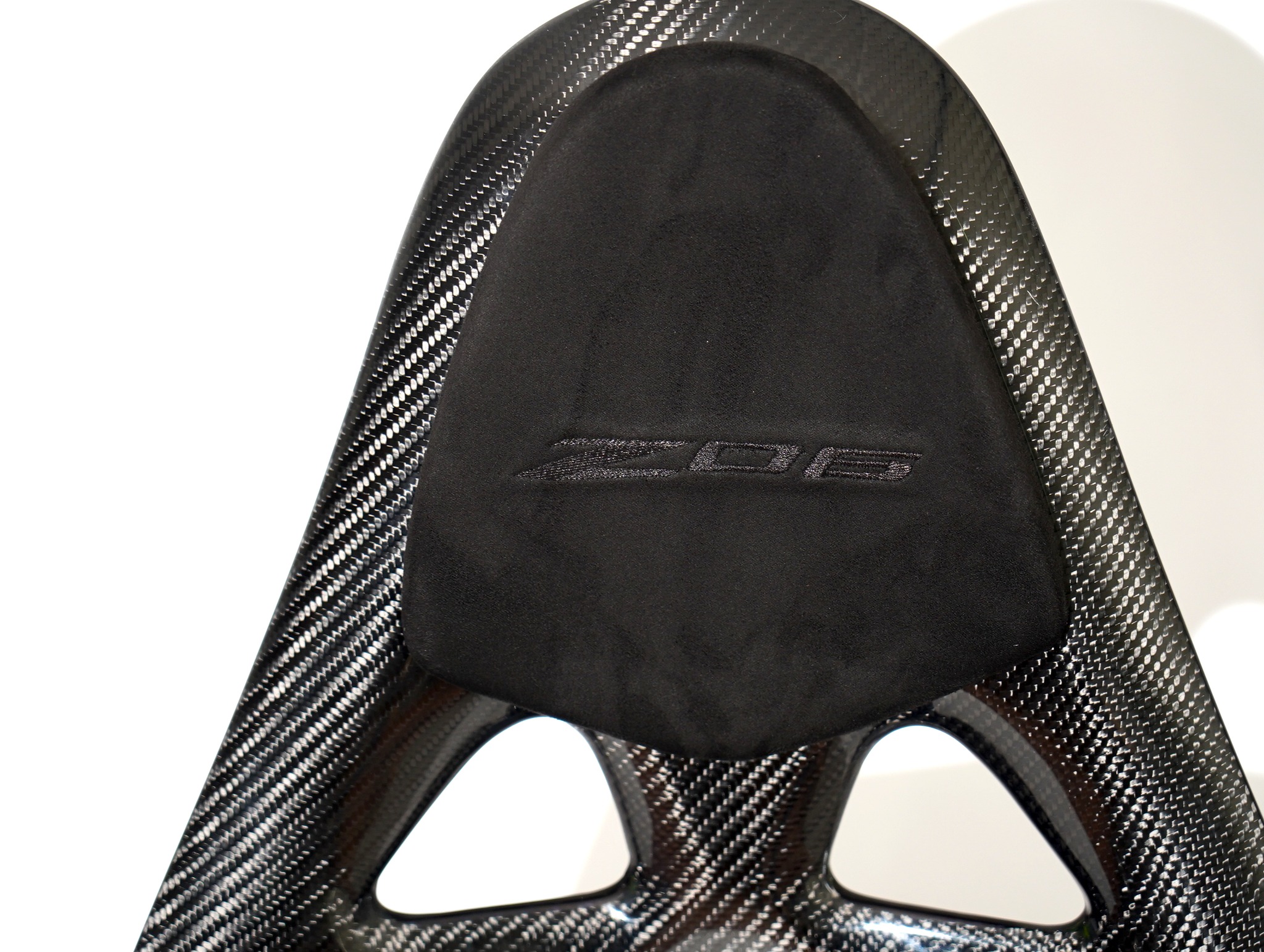 CF Seats V3 with custom padding, black leather mixed with black Alcantara + Corvette Z06 logo stitching on headrest padding.