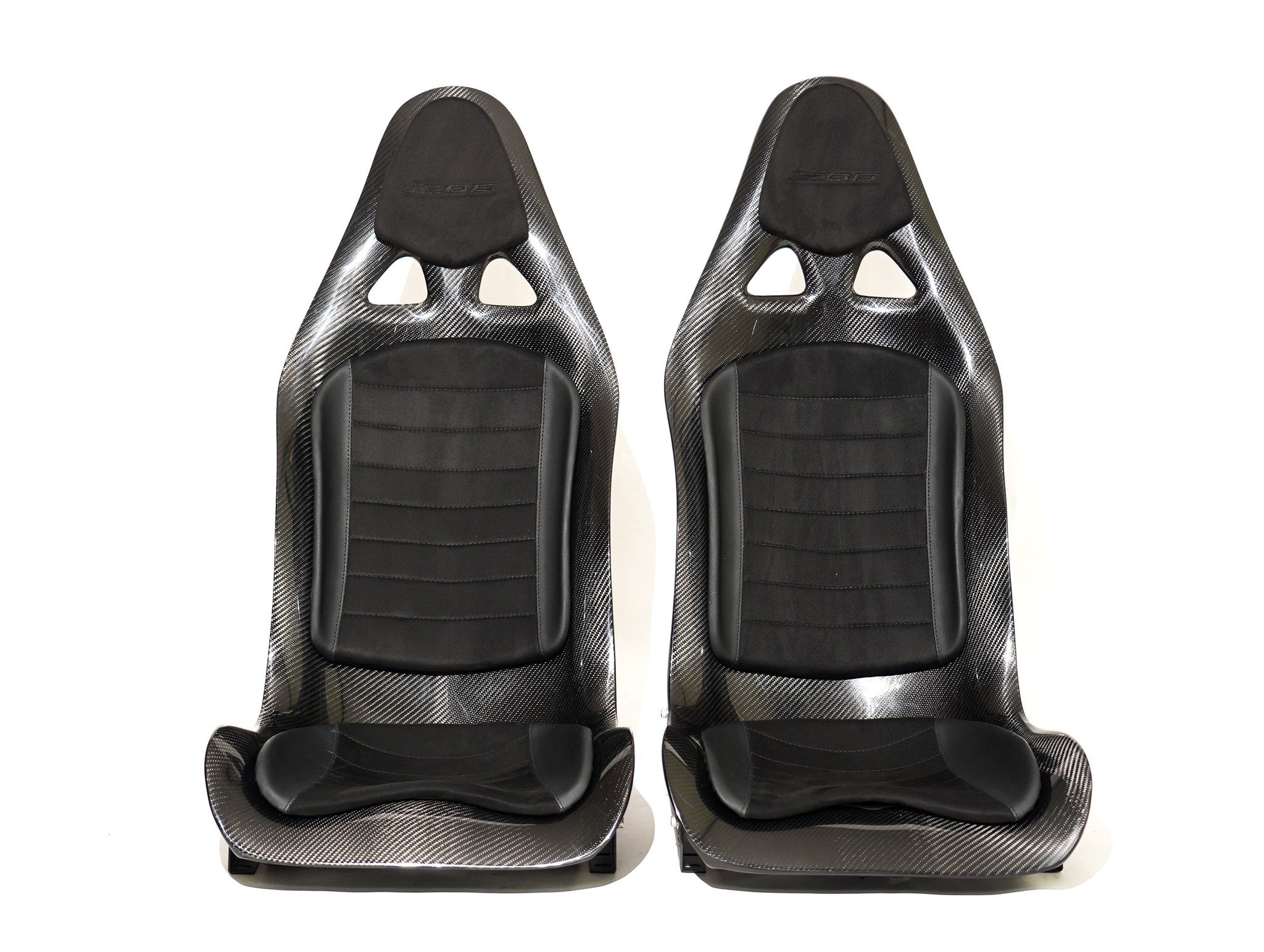 CF Seats V3 with custom padding, black leather mixed with black Alcantara + Corvette Z06 logo stitching on headrest padding.