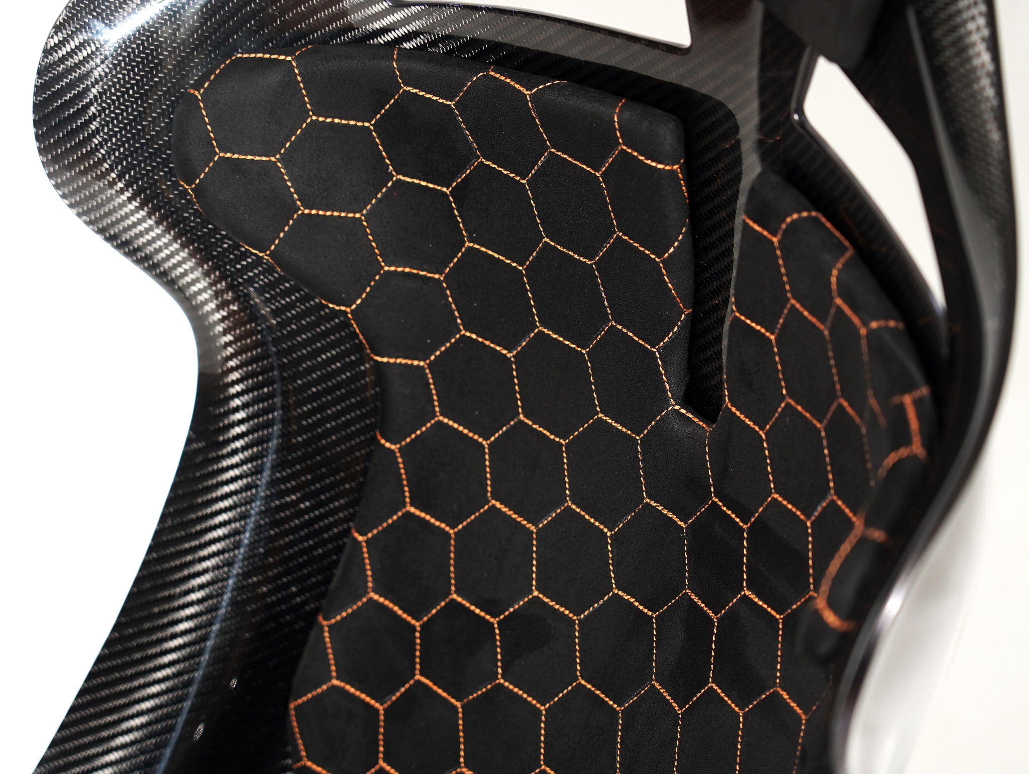 CF Seats V5 with black Alcantara padding and orange honeycomb stitching pattern + orange Audi RS logo on headrest padding.