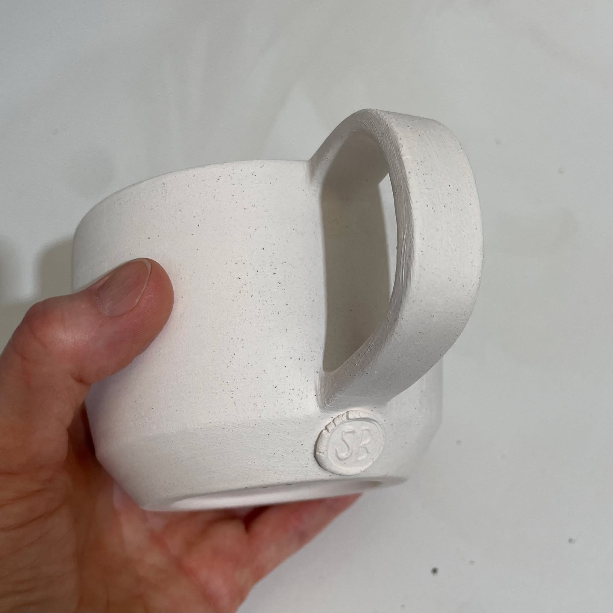 As I've continued to develop my Pottery skills with wheel-throwing over the last year, I have come to realise that I am definitely NOT going to be a production potter!
Every time I sit on the wheel, I have something in mind to make but ultimately, I am at the mercy of the clay.
My mind also wanders along with my hands on the clay, trying different shapes, testing the clay to see how far I can stretch it.
So, now I have found my lane in the pottery world and I'm happy with it.
Each one of the pieces I make will be a "one-and-only", never repeated, in shape, size, angles, & colour. Every aspect of each piece will be different , but also a little similar from the next one, until I am done. Even though all of these cups are different, they will all still work the same and look great on a shelf or a kitchen cupboard.
Look out for the finished glazed collection........coming soon!
#supportlocalartists #handmadeceramics #inspiredbynature #artforeveryone #ceramicdesign #getcreative #potterylove #clayfun #soulclaystudios #southcoastceramics