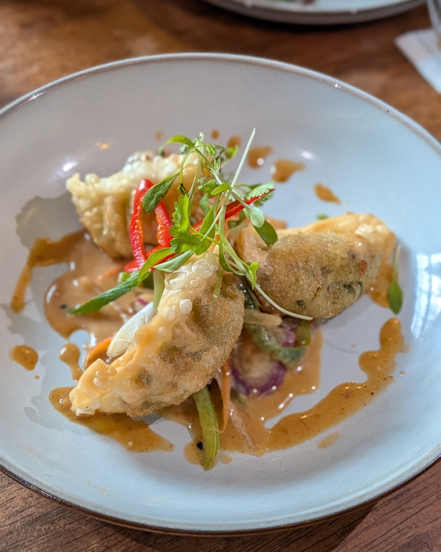 ✨ Introducing Our New Thursday Night Theme! ✨
Join us this Thursday 16th April from 6pm for the launch of our exciting Asian Night 🍜🥢
Enjoy fresh, vibrant ingredients, all cooked to order and inspired by our head chef’s true passion for Asian cuisine. Every dish is made from the heart, and we can’t wait for you to experience it.
Tables are expected to fill quickly, so be sure to book online, give us a call, or pop in to avoid disappointment.
We look forward to welcoming you! 🌟
Menu
Starters – £8
Chicken Satay Skewers (V option available)
Grilled skewers served with a rich, creamy peanut sauce
Duck Gyoza
Pan-fried dumplings filled with tender duck and aromatic spices
Vegetable Spring Rolls (V)
Crisp rolls packed with fresh vegetables, served with a dipping sauce
Hoisin Pork Bao Buns (V option available)
Soft steamed buns filled with hoisin-glazed pork and pickled vegetables
Tempura King Prawns
Lightly battered king prawns, fried until golden and crisp
Salt & Szechuan Pepper Squid
Crispy squid tossed with fragrant Szechuan pepper and sea salt
Mains – £12
Lamb Massaman Curry (GF)
Slow-cooked lamb in a mild, aromatic Thai curry with coconut and spices
Crispy Duck Noodles (GF)
Shredded crispy duck served over rice noodles with a savoury glaze
Curried Lamb Shank with Curried Coconut Lentils (GF) (+£4)
Tender lamb shank marinated and slow braised
Korean Pork Burger
Juicy pork patty glazed with Korean spices, served in a soft bun
Teriyaki Chicken (V option available)
Grilled chicken glazed in sweet teriyaki sauce, full of umami flavour
Pad Kra Phao Moo Krob
Crispy pork stir-fried with chilli, garlic, and Thai holy basil
Stir-Fried Monkfish with Lemongrass, Ginger & Chilli (+£4)
Fresh monkfish wok-fried with fragrant herbs and a touch of heat
Sides – £4
Cucumber Salad
Refreshing, lightly dressed cucumber with a hint of sweetness
Special Fried Rice
Wok-fried rice with egg, vegetables, and savoury seasoning
Prawn Crackers
Light,
Seaweed
Sticky Rice
Soft, steamed rice—perfect for pairing with curries