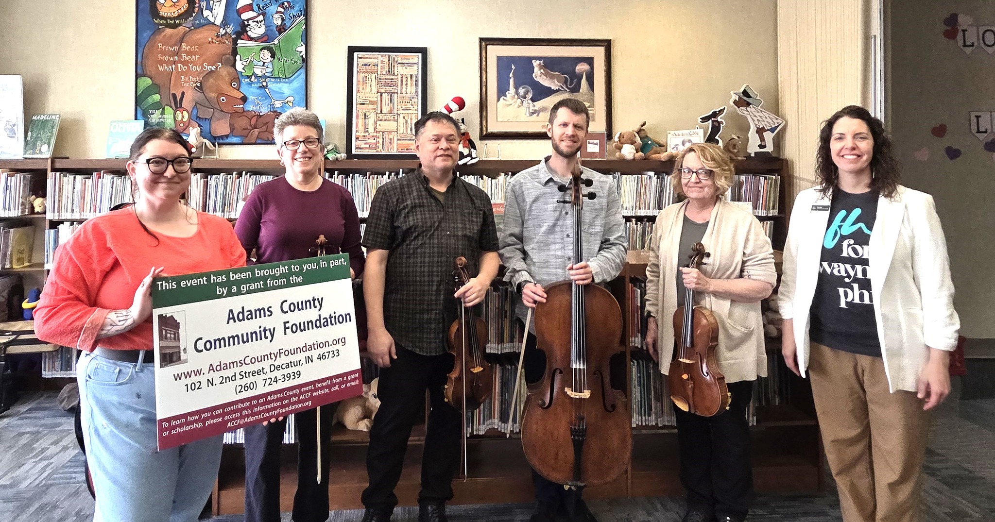 Adams County Community Foundation (ACCF) grants to Adams Public Library System (APLS) for the Fort Wayne
Philharmonic Orchestra’s Stories in Music’ where stories and sound come together and create education and
entertainment. Philharmonic ensemble musicians bring beloved children’s books to life by providing musical
accompaniment to popular children’s books, read by a Philharmonic staff member.
Though the program’s intended audience is children, it was noted several adults enjoyed the performance as well. At
the end of the performance the Philharmonic staff member facilitates a ‘question and answer’ time where the children are able to ask the Philharmonic musicians about their instruments, the story they heard, or general music questions.
Louise Ray, ACCF BoD president, reported that the Adams County Community Foundation (ACCF) is pleased to announce that the APLS was awarded a grant in support of this community-music program. The Fort Wayne Philharmonic brought their ensemble to the Decatur Library to reach residents of Adams County. Bee Gray-Chemey, APLS staff and grant writer, added that the ensembles provided Adams County residents with an opportunity to experience a renowned orchestra performing live in their very own community. This was a popular program, and we appreciate ACCF’s support.
This ACCF grant was made possible through unrestricted fund sponsored by the Charlie and Jean Brune Family Community Enrichment Funds.