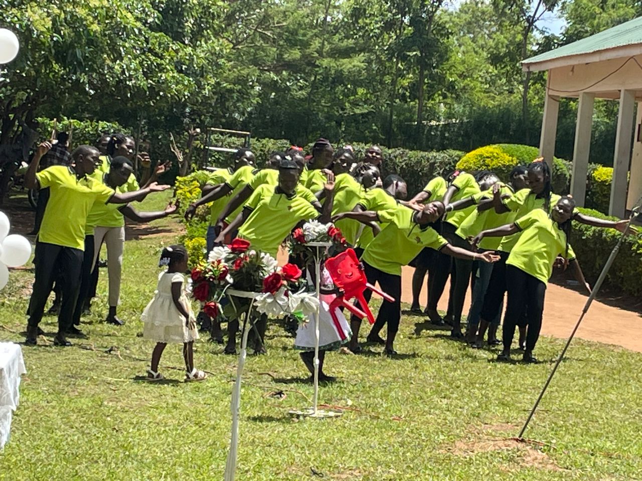 Saturday marked a powerful milestone as CAPAIDS Uganda celebrated the graduation of over 20 resilient adolescent girls and survivors of sexual and gender-based violence at Friesen Harvey's Home of Hope in Boroboro, Lira City, Uganda. These graduates successfully completed the intensive six-month Youth Rehabilitation & Skilling Program in sewing and hairdressing.
Tanya Cothran, Executive Director of Spirit in Action, joined the celebration online as a special guest. She congratulated the young women, recognizing how far they'd come in 6 months, reminded them that, even though we are far apart physically, we are all connected in God's loving family, and encouraged them as they bravely go forth to start their own small businesses and care for themselves and their families.