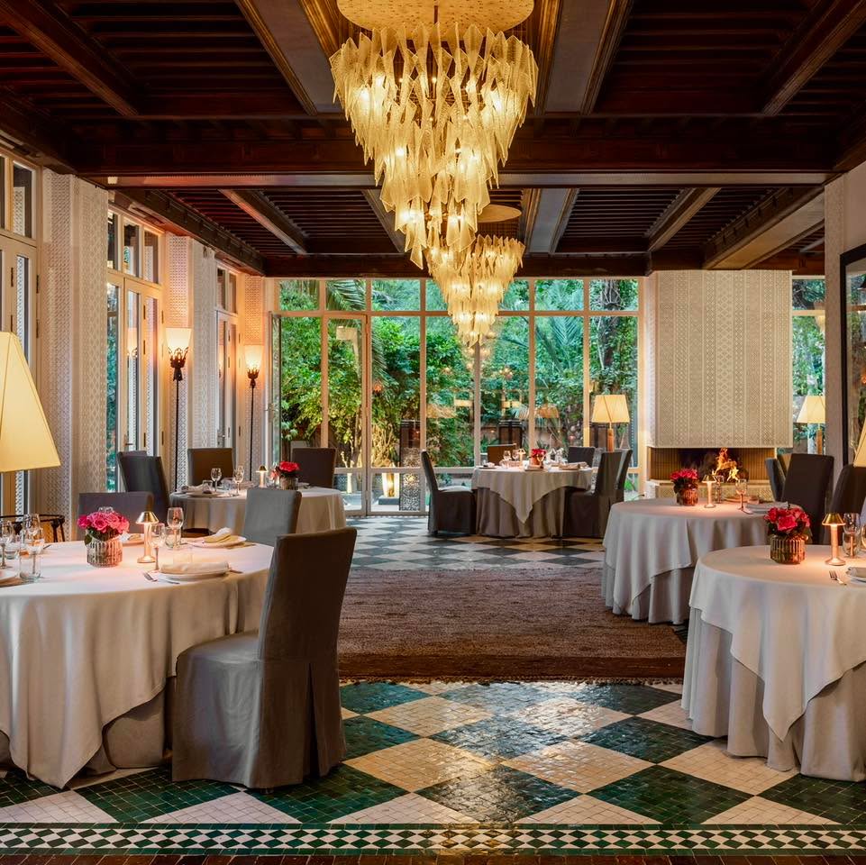 As the light softens and the garden comes alive, dinner begins long before the first plate arrives.
Tables set beneath palms, candles flickering between shadows, and the quiet rhythm of an evening unfolding slowly.
Through the arches, the experience shifts. From intimate corners to open courtyards, each space reveals a different atmosphere, yet all connected by the same sense of calm and refinement that defines the riad experience.
Because here, dining is not just about the table. It is about the setting, the silence, the details, and the feeling of being somewhere completely removed from the outside world.
A moment suspended between nature and elegance.
#marrakechdining #riadexperience #gardendinner #luxuryescape #marrakechnights