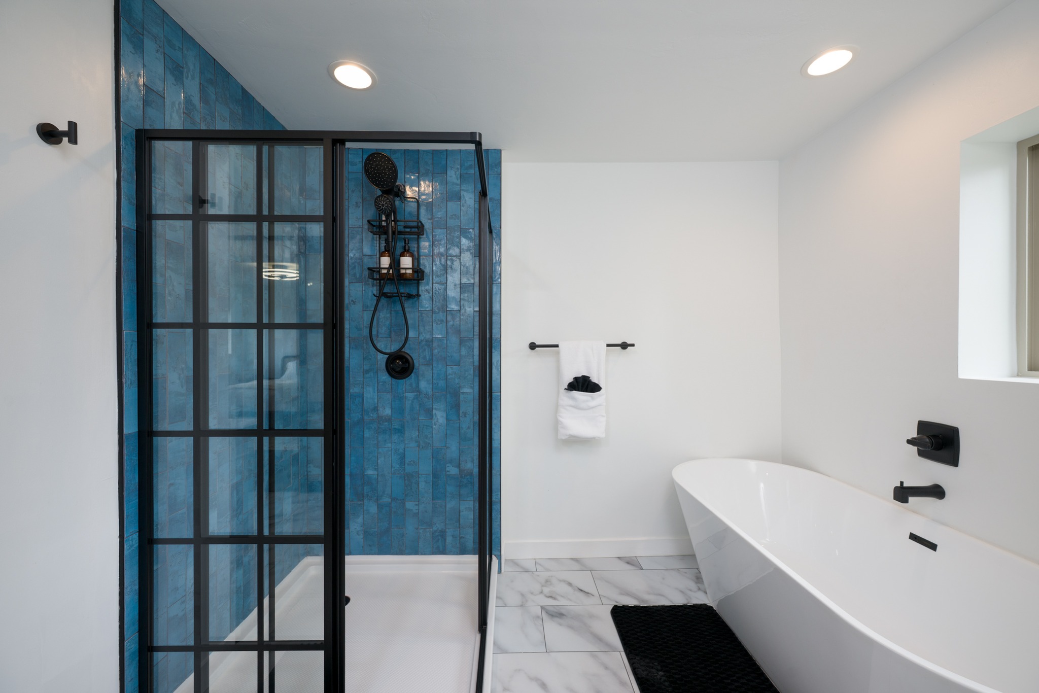 White walls holding everything still, then that wall of color steps in and takes over.
Sharp lines.
Black framing.
A grid that keeps it structured.
But the blue — that’s where it breathes.
It softens the precision
just enough to feel human.
Because good design isn’t just control — it’s knowing exactly where to let go.
📩If your project is built on simplicity done right, let’s capture it that way.
#architecturalphotography #bathroomdesign #contrast #materialplay #moderninterior #designbalance #realestatemarketing #QuietDesign #joncahillphoto