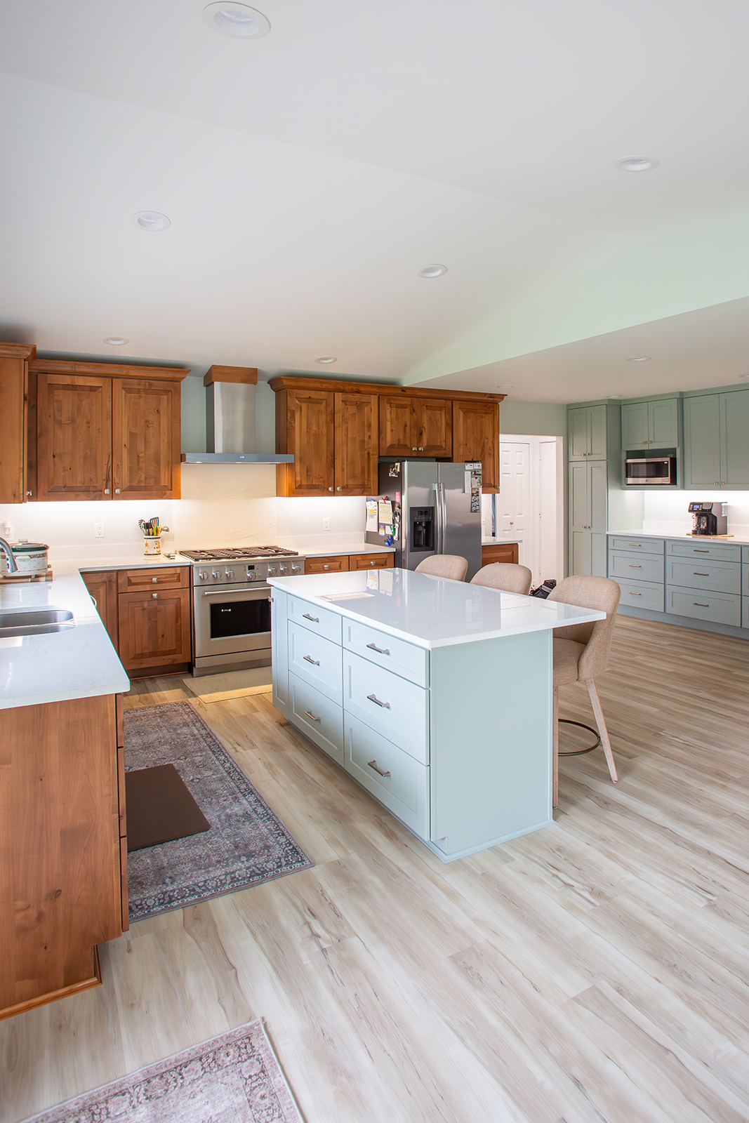 Here's a second look at the kitchen in a new addition out in Bay City. It's open, bright, and honestly, just has that easy, lived-in charm.
We were able to reuse the homeowner’s existing Lanchester Butternut cabinets and blend in a few new pieces so seamlessly you’d never even know what was added. That mix was then paired with Legacy Cabinets in Silvermist, and the combo just works.
We tied it all together with Cambria quartz in MacBeth from Blasius Countertops, and finished it off with Akadia luxury vinyl plank flooring that keeps the whole space feeling warm and durable without overthinking it. 10/10!
Michigan Contractor | Kitchen Addition | Bay City Contractor | Cambria Countertop | Legacy Cabinets | MSI Flooring | Large Kitchen