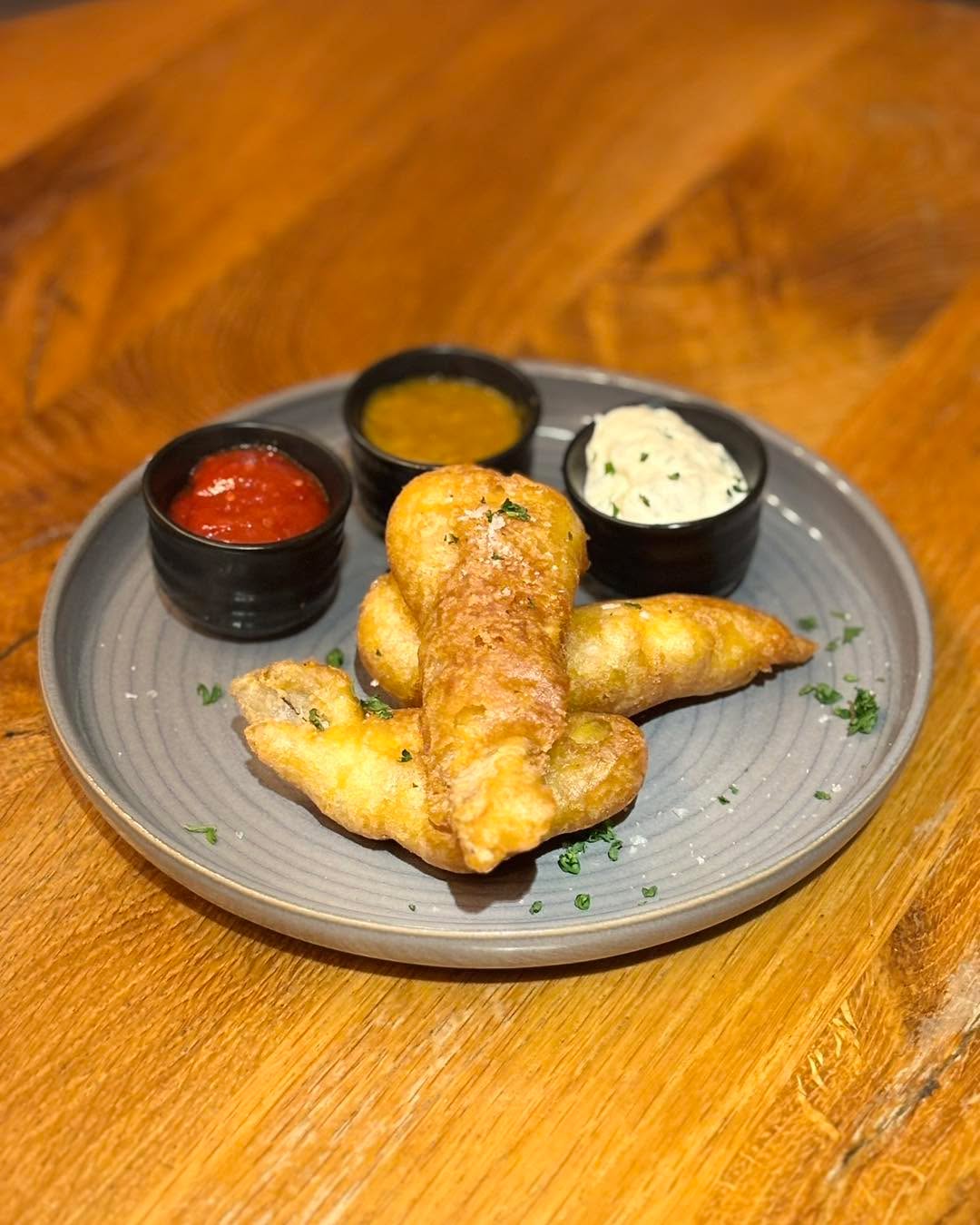 Craving a proper Fish & Chips night without the hassle?
Try our new and improved Fish & Chips — now made with our house-crafted, fully gluten-free batter!
It’s light, crispy, and perfectly fluffy… just the way it should be.
Ideal for those evenings when cooking feels like too much let us take care of it for you.