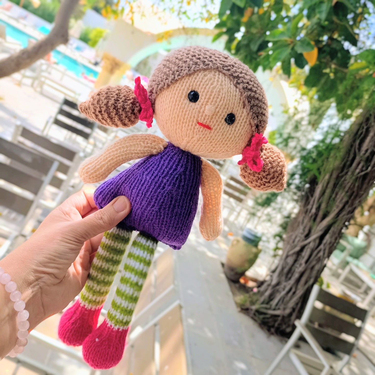 I've so enjoyed creating this little girl over the last week.
Knitting by the pool in the sunshine!
I hope you like her, too.
Thanks for being so patient- I've published her now on Ravelry
https://www.ravelry.com/patterns/library/friendship-dolls-2