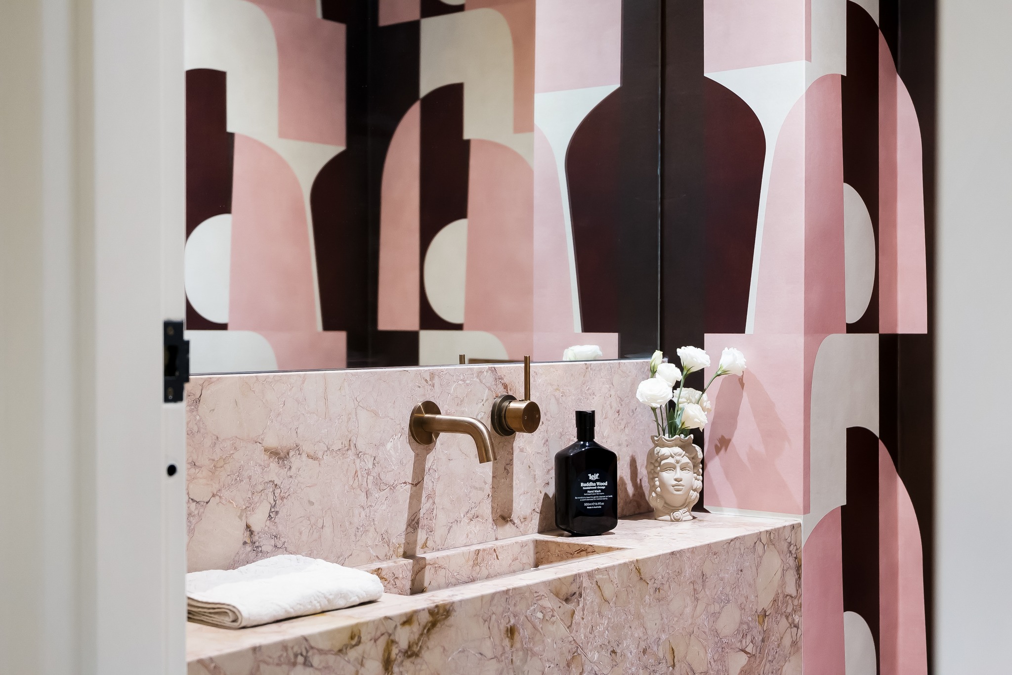 Materiality is what gives a room its pulse.
I am endlessly drawn to stone with movement. Veining that feels almost painterly, tones that shift between blush and sand. It creates an emotional landscape within the space.
Here, the carved marble basin feels monolithic yet soft. Sculptural. Grounded.
The bronze tapware introduces a burnished warmth against the stone, while the graphic geometry behind it sharpens the composition with rhythm and contrast.
What makes a space unforgettable is tension.
A room should never feel static. It should feel alive.
#TheEscapistandCo #KirribilliTerrace #Materiality #SculpturalInteriors #StoneInteriors #MarbleBathroom #NaturalStone #InteriorAtmosphere #LuxuryInteriors #BathroomDesign #ArchitecturalInteriors #InteriorDetails #TexturalDesign #CuratedInteriors #ResidentialInteriors #AustralianInteriors #InteriorInspiration #BronzeDetails #QuietLuxury #DesignMood