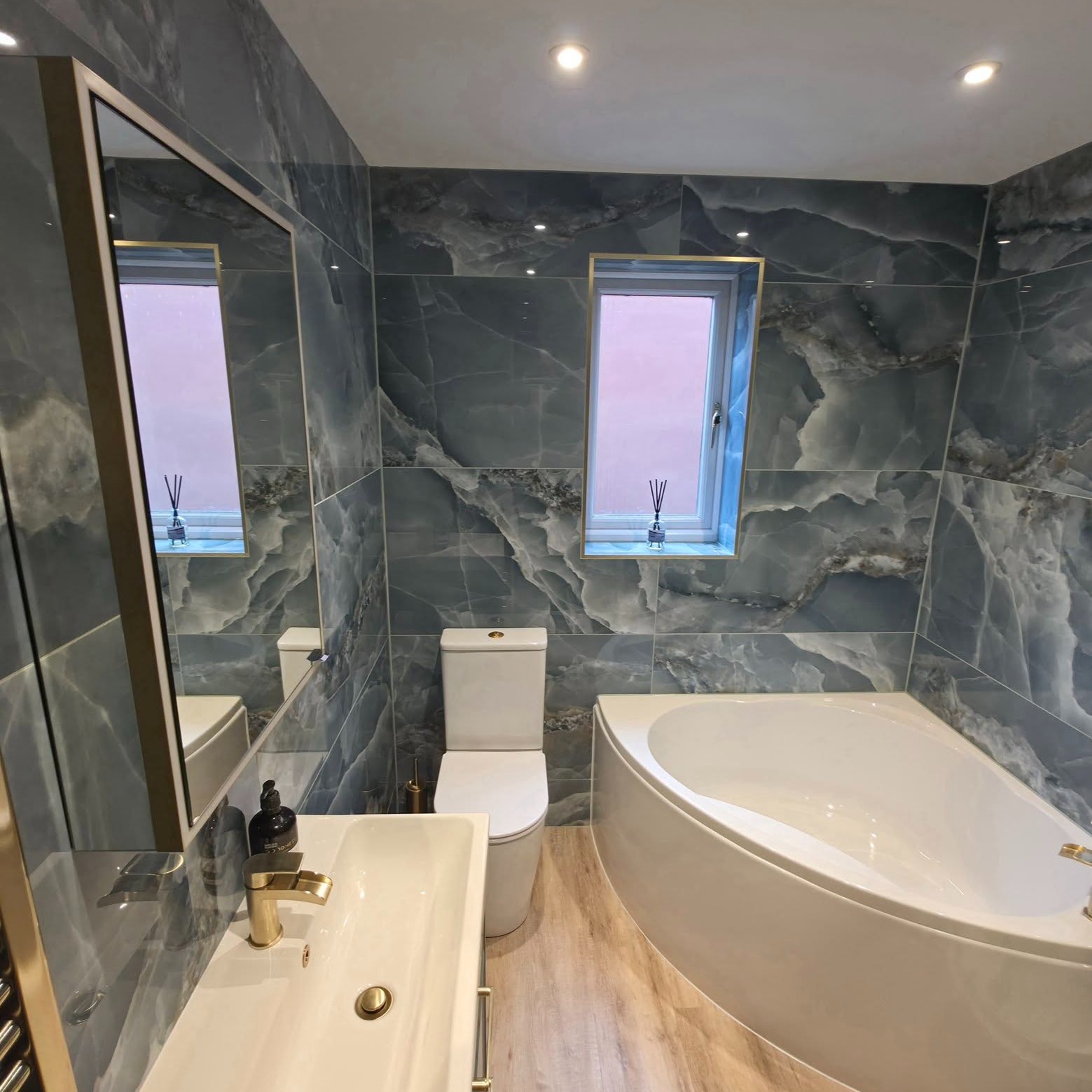 A stunning bathroom renovation that brings a true luxury hotel feel into the home.
Elegant brushed brass fittings pair beautifully with striking marble-effect wall tiles in a generous 1.2m x 600 format, creating a seamless, spacious, and sophisticated look. The continuous flooring enhances the flow, while Tavistock furniture adds both style and practicality.
Soft tones, large-format tiles, and an airy layout create a calm, relaxing atmosphere — the perfect place to unwind at the end of the day. Every detail has been thoughtfully chosen to achieve a timeless, luxurious finish with comfort at its core.
Our lovely customer is delighted with the results and you an see why!
A truly stunning transformation.
Well done to Steve and Phil for the fitting, with Lee and Ed on the electrics. Well done team!
#BathroomRenovation #LuxuryBathroom #BrushedBrass #MarbleEffectTiles #TavistockBathrooms #BathroomInspo #HomeRenovation #InteriorDesign #LuxuryInteriors #BathroomDesign #RelaxationSpace #ModernBathroom
www.goodwinskbb.co.uk