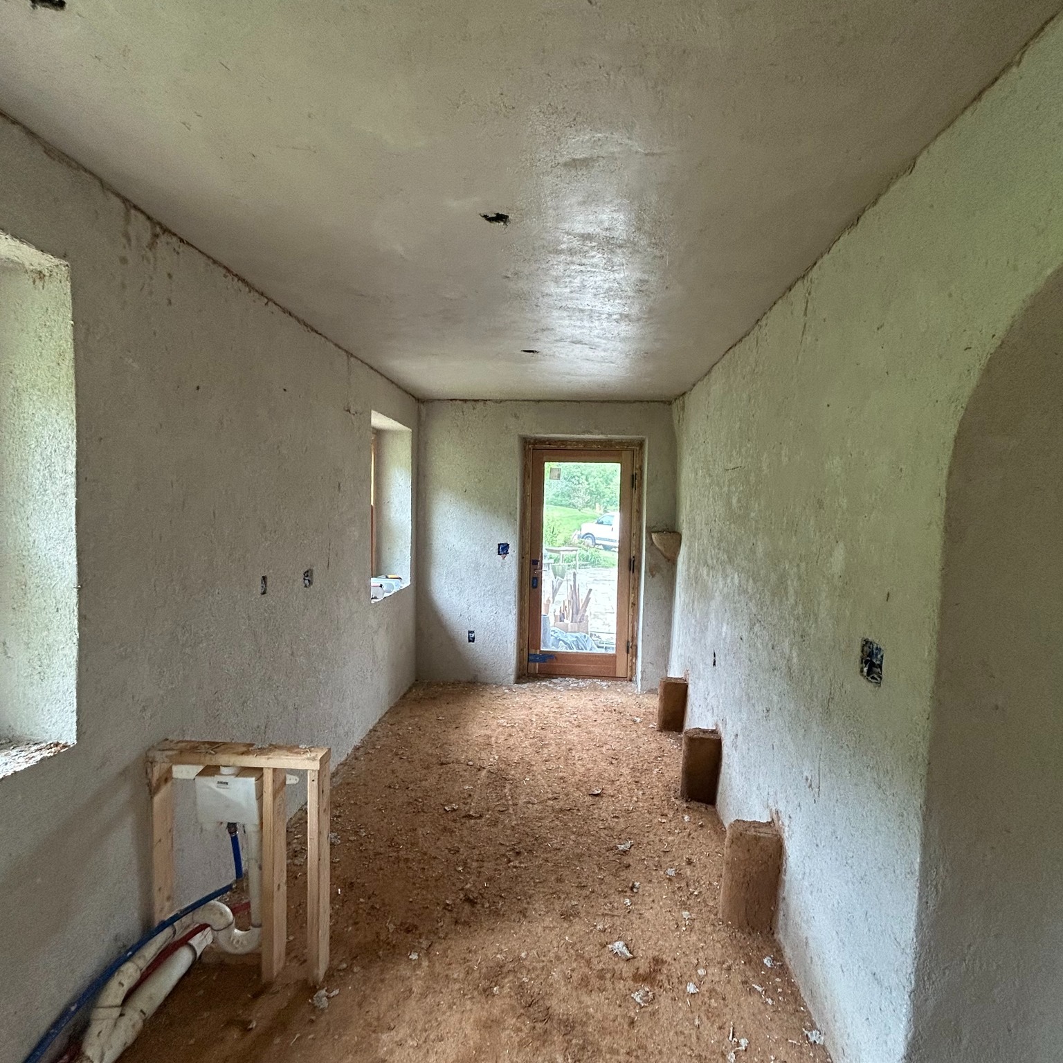 Step-by-step clay plaster ceiling finish over wood lath:
(photos in reverse order)
1️⃣ Step 1: make sure your ceiling framing is all in the same plane
ie, whatever shape you want your finish ceiling to be (usually that means flat, but not always)
2️⃣ Step 2: attach wood lath
Wood lath simply refers to strips of wood, attached to each framing piece, & installed with a gap in between. The thickness of the wood depends on the spacing of your framing (5/16" wood strips for walls and anything 16" on center or less; 3/8" thick strips for 24" on center spacing). I use stainless steel ring shank nails for this (especially on a ceiling) because they are least likely to either corrode or pull out. The spacing of the gap is typically 5/16" to 3/8" for most plasters. The plaster squishes through the gap & flops over...called a "key". The key is what holds the plaster on over time
3️⃣ Step 3: apply a fiber-rich base coat of plaster
In this case, we used chopped straw & hemp fiber. The fiber is what ensures the key doesn't break over time. It is critical to leave some texture on this coat so the next coat has something to adhere to. We used site clay for this layer because it's free & it's much stronger than purchased processed clay. Let this coat dry fully
4️⃣ Step 4: apply a second coat of clay plaster. This is usually a finer mix, it could still have fiber in it, or it could just be a combo of clay & sand. (You could also go right to a finish plaster here.) We switched to white purchased clay here so that we have a white substrate for the finish (which might be a lime wash or clay paint). Our mix also includes sand & chopped straw. Let this coat dry fully
5️⃣ Step 5: finish as you like
Choices are: clay paint, lime wash, milk paint, thin finish clay plaster, etc. I will post when we do this step as well. We might do a combination of things to demonstrate a couple options. 🙃
All of the plaster is the amazing work of @theartofplaster
Our wood lath was installed by @goodbuilding
We chose clay because it regulates both temperature & humidity in the space.
#naturalrenovation #clayplaster #lathandplaster #traditionalbuilding #naturalbuilding #stepbystep