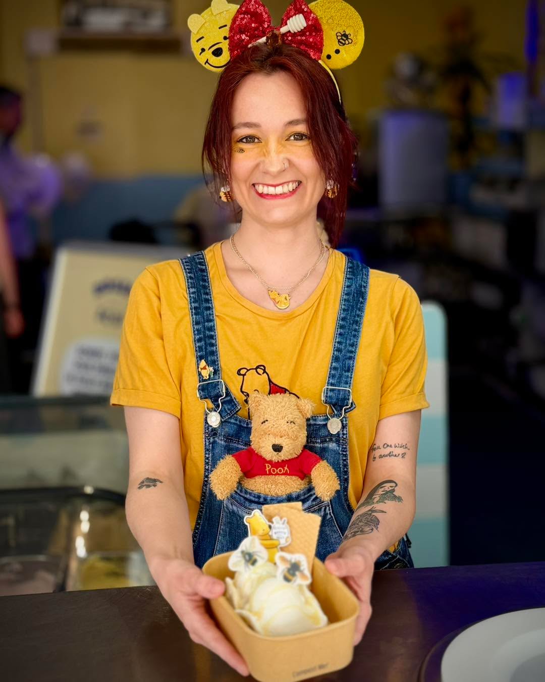 This is Shan! 🍯
She’s part of the Rossi’s team. It was actually Shan’s idea to celebrate Winnie the Pooh’s 100th anniversary today so Ben got to work on the sticker design and Aimee created the sundae.🐝
Pooh, Tigger and Roo bringing you all One Hundred Acre Goods at Rossi’s Ices🩷
