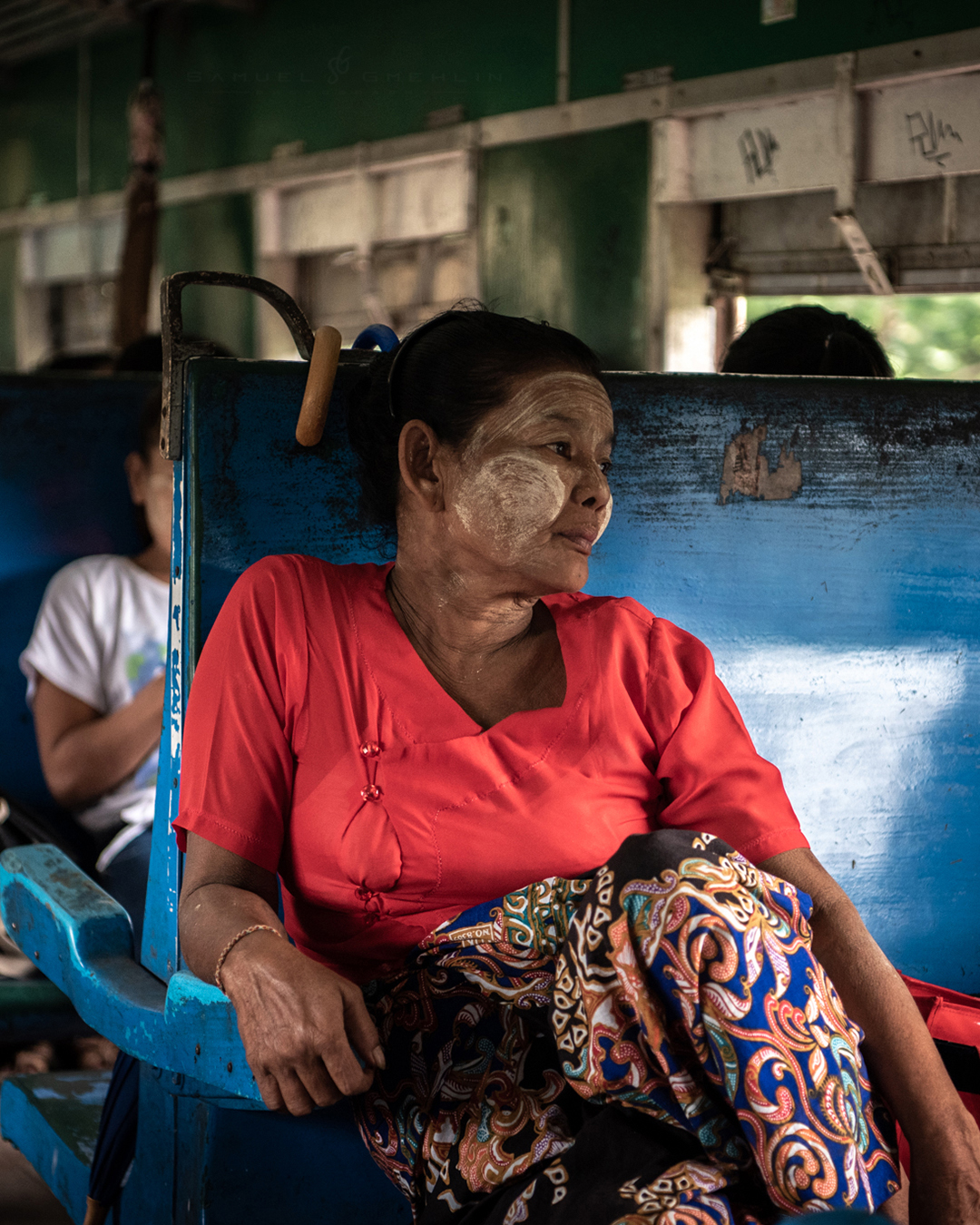 The Weight of Ordinary Days
•
One thing I always enjoyed while traveling in Myanmar was taking local trains without really knowing where they would lead. They were slow, noisy, uncomfortable at times, but also full of moments like this that stayed with me much longer than any famous landmark. I liked how calm and thoughtful this woman looked while the train kept moving through Yangon’s suburbs. The faded blue seats, warm light, and everyday atmosphere made the whole scene feel incredibly human and real. 🚆🖤
•
Swipe ➡️ for the print version.
•
@nikonasia #nikond750 AF-S 24-70mm f/2.8 ED VR II
•
ISO 800 | f/2.8 | 1/160s
•
#people_and_world #humanity_shots #world_portraits #atlasofhumanity #natgeo_humanity #worldcolours_people #streetmoments #streets_storytelling #streetphotographyhub #streetphotographyworldwide #yangon #myanmar #ミャンマー