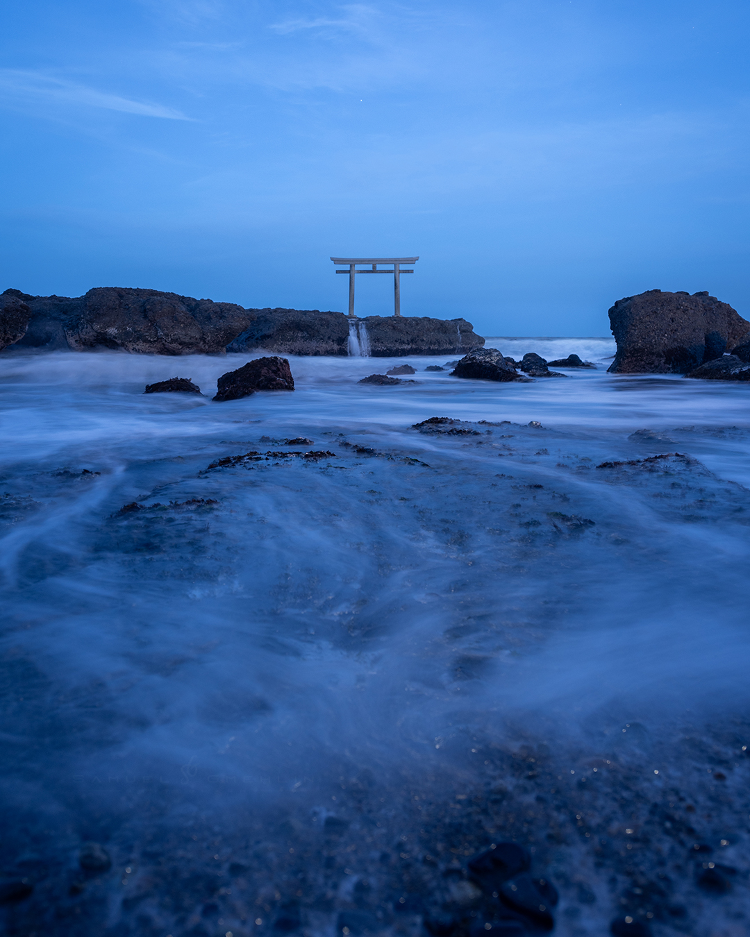 Gods Do Not Need Walls
•
Most torii gates in Japan are bright red, so finding one standing alone on the rocks facing the Pacific Ocean already felt different. I stayed there during blue hour while the waves kept covering the foreground over and over again, turning the entire shoreline into this soft moving texture. The atmosphere was incredibly calm, almost unreal, with nothing around except the sound of the ocean and the silhouette of the gate against the fading blue sky. 🌊⛩️
•
Swipe ➡️ for the print version!
•
@nikonjp #nikond750 AF-S 24-70mm f/2.8 ED VR
•
ISO 100 | f/3.5 | 4s
•
•
#art_of_japan #bestjapanpics #bestphoto_japan #love_bestjapan #instagramjapan #lovers_nippon #raw_japan #tokyocameraclub #majestic_earth #ourplanetdaily #大洗磯前神社 #茨城県 #大洗町