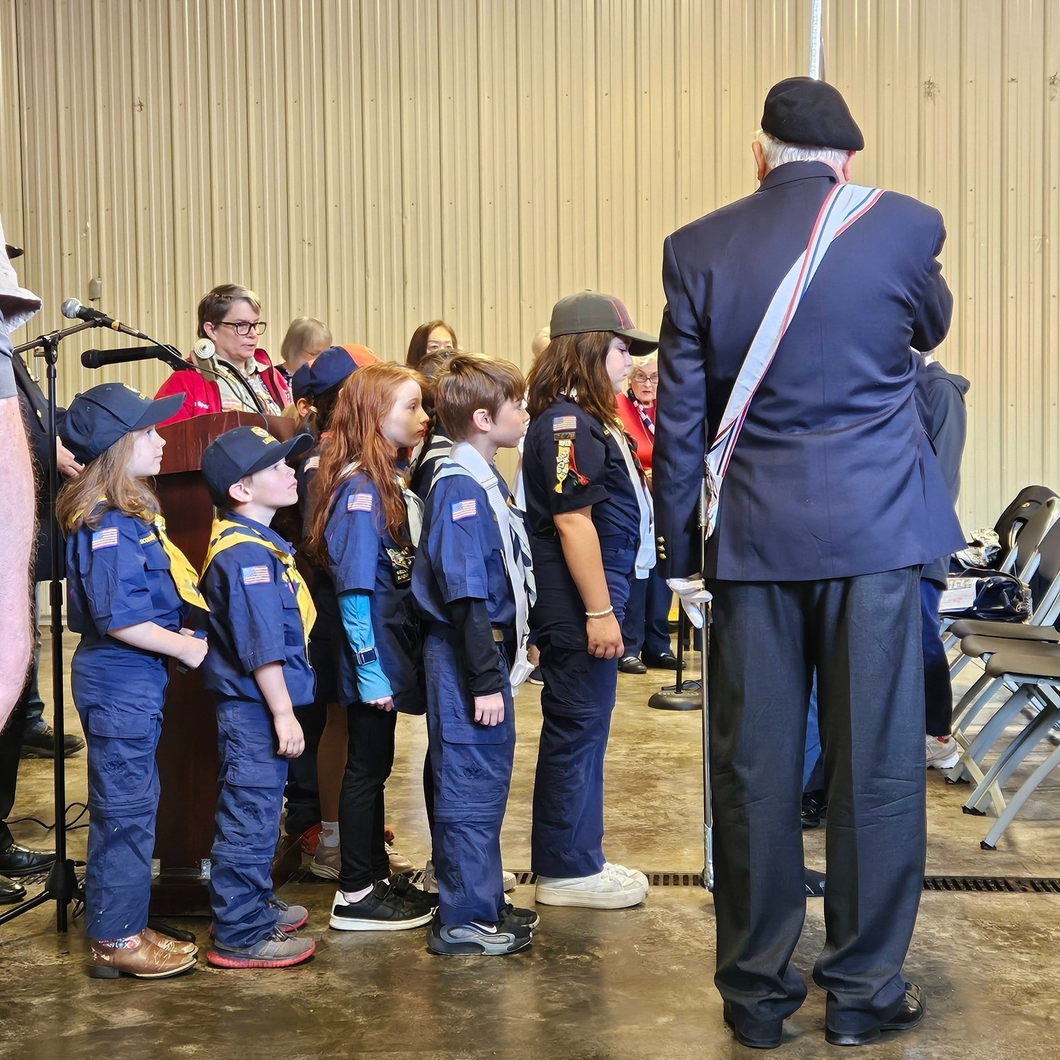 On Memorial Day, Monday, May 25, 2026, the Hemlock Farms community came together for a meaningful Memorial Day Service held at the Hemlock Farms Vol. Fire and Rescue Co. Pole Barn. Sponsored by the HFVF&R Co. and the HFVF&R Company/EMS Chaplains, the service reflected the unity, gratitude, and patriotism shared throughout the community.
Rabbi Johanan Bickhardt led the service, joined by representatives from each of the communityโs houses of worship as they spoke to remember and honor the brave men and women who made the ultimate sacrifice in service to our nation and our freedom.
The Presentation of Colors and recitation of the Pledge of Allegiance by Cub Scout Pack 007 served as a powerful reminder of the importance of passing the true meaning of Memorial Day on to future generations. The tradition and symbolism carried by the St. John Neumann Knights of Columbus Fourth Degree Color Guard added further dignity and reverence to the ceremony.
Speakers included Deacon John Hanley of St. John Neumann Roman Catholic Church; Kim Igel and Pastor Chad Benkert of The Church at Hemlock Farms; Rabbi Samuel Barth of the Jewish Fellowship of Hemlock Farms; and keynote speaker Commander Harry Waidelich, United States Navy (Retired). Community Manager Shaun Nordlie participated in the laying of the memorial wreath in honor of our fallen service members.
Throughout the service, the voices and instruments of the Deanery Choir filled the Pole Barn with patriotic music and heartfelt tributes, creating a moving atmosphere of remembrance and respect for our nationโs fallen heroes.
Thank you to all of the volunteers (including CERT, HFVF&R, and EMS personnel) participants, staff, and community members in attendance whose contributions helped make this service so meaningful. Your involvement reflects the deep appreciation and respect our community holds for those who gave their lives in service to our country.
This Memorial Day, we remember not only the sacrifices made, but also the enduring legacy of courage, service, and freedom left to us by Americaโs fallen heroes.