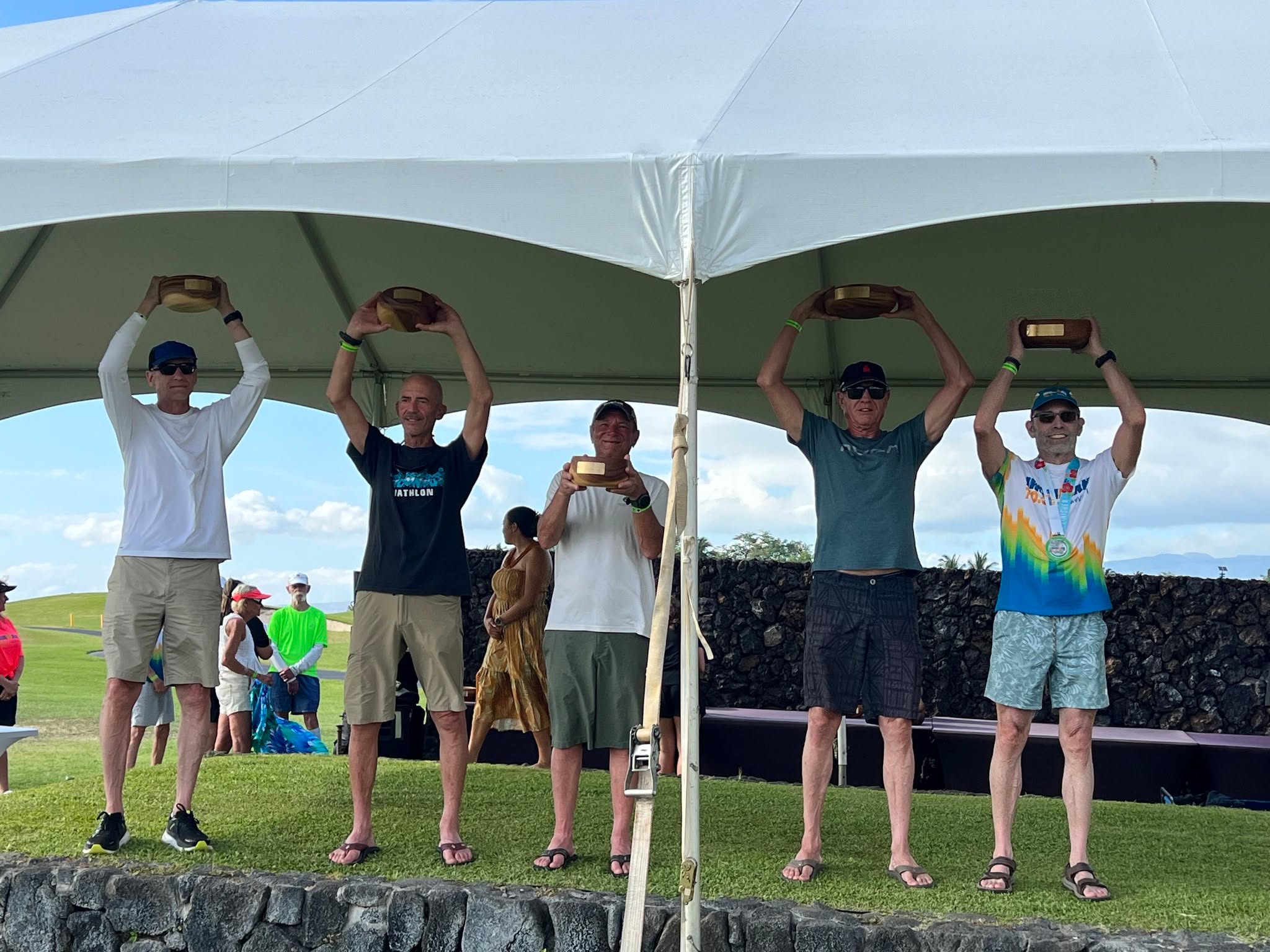 Honu 70.3 . . . My favorite triathlon (yes, even better than IMWC)
We got to the island early so I could acclimate, which worked. Scary going into the race because the winds near Waikoloa were insane!
The island gods were kind race day, however. It was hot but the winds died down.
I had a terrible swim so I've got to dial some things in there but the bike was on target. My run was a bit slow but I managed 2nd place M70-74.
Congratulations to Alex Davis who managed to beat me by over 2 minutes.
Aida insisted I stick around for the roll-down because she and my tri-pal, Larry Davidson thought I might get one of the 2 slots that weren't claimed. Sure enough, I got one of the two. So, major thanks to LarDog and Aida for the support.
I also want to thank fellow Racer, Mark Arenal and his lovely wife Corinne. Many others helped me along the way including my OC bike wizard, David and my Kona bike master Zeb. These guys are simply the best. No, I'm not passing on their 411! I'm very greedy.
Anyway, I always wanted to do "Kona" one more time so we will be back in October
Mahalo, and aloha!