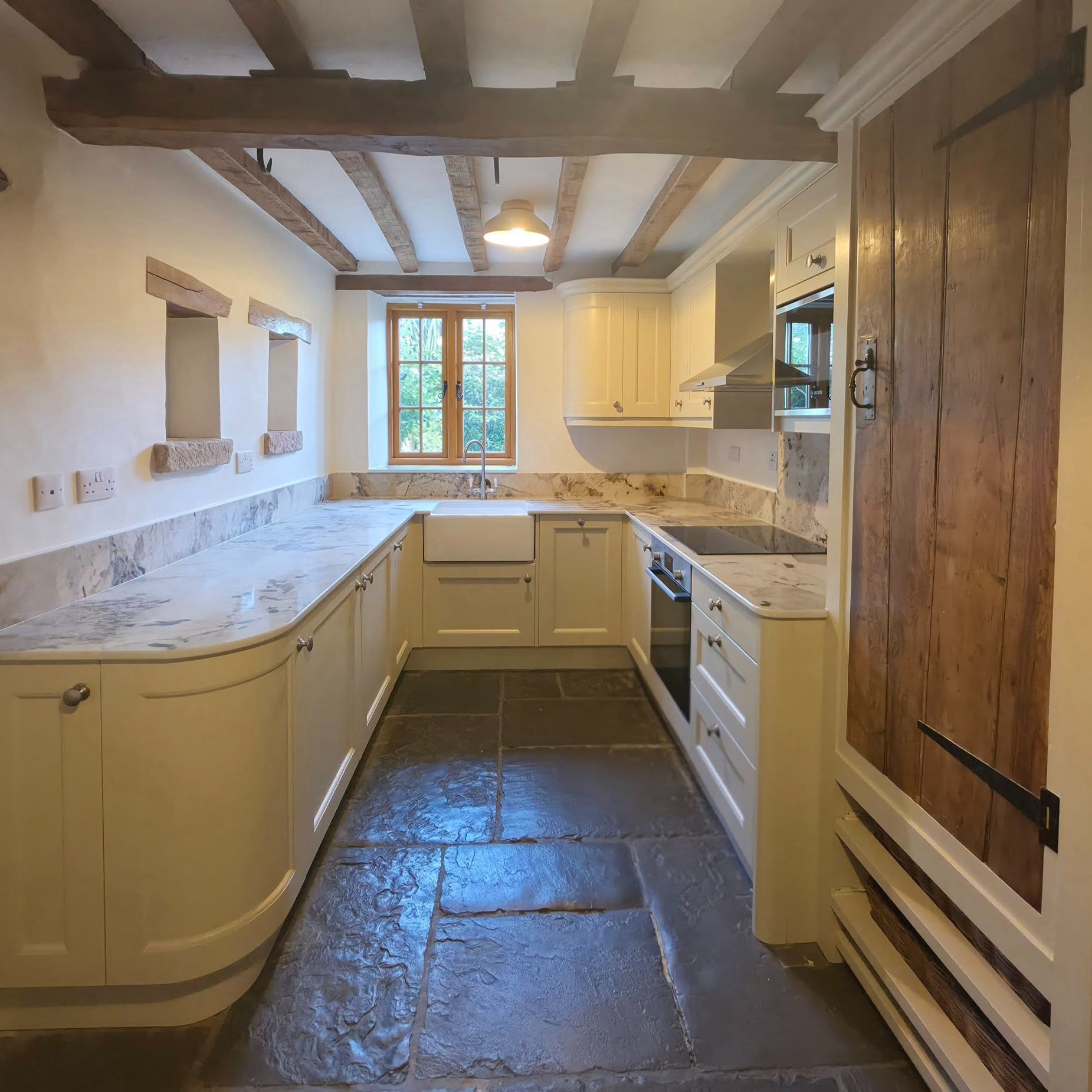 Another Beautiful Kitchen Transformation Completed
We recently transformed this beautiful kitchen, replacing the existing space with a timeless shaker-style timber kitchen featuring a beaded door design. Each unit was hand-painted on site to create a truly bespoke finish.
The kitchen includes premium Bosch appliances for reliable everyday performance, paired with elegant 20mm ceramic worktops that offer both style and durability.
What makes this project especially striking is how naturally the new kitchen sits within the home’s original character. The hand-painted cabinetry complements the traditional oak beams and flagstone flooring perfectly, creating a warm and welcoming space that blends classic charm with modern practicality.
The finished result is a kitchen that looks as though it has always been part of the home — a functional family space with timeless character and appeal.
A big well done to Jim and Lee for the fitting, Lee for the electrical work, and Jason and Will for painting both the kitchen units and the room.
If you’re thinking about renovating your kitchen, we’d be delighted to help bring your ideas to life.
Get in touch to discuss your next project.
www.goodwinskbb.co.uk
#KitchenRenovation #ShakerKitchen #HandPaintedKitchen #BoschAppliances #WirksworthKitchens #CeramicWorktops #TraditionalHome #KitchenDesign #BespokeKitchen #GoodwinsKitchens