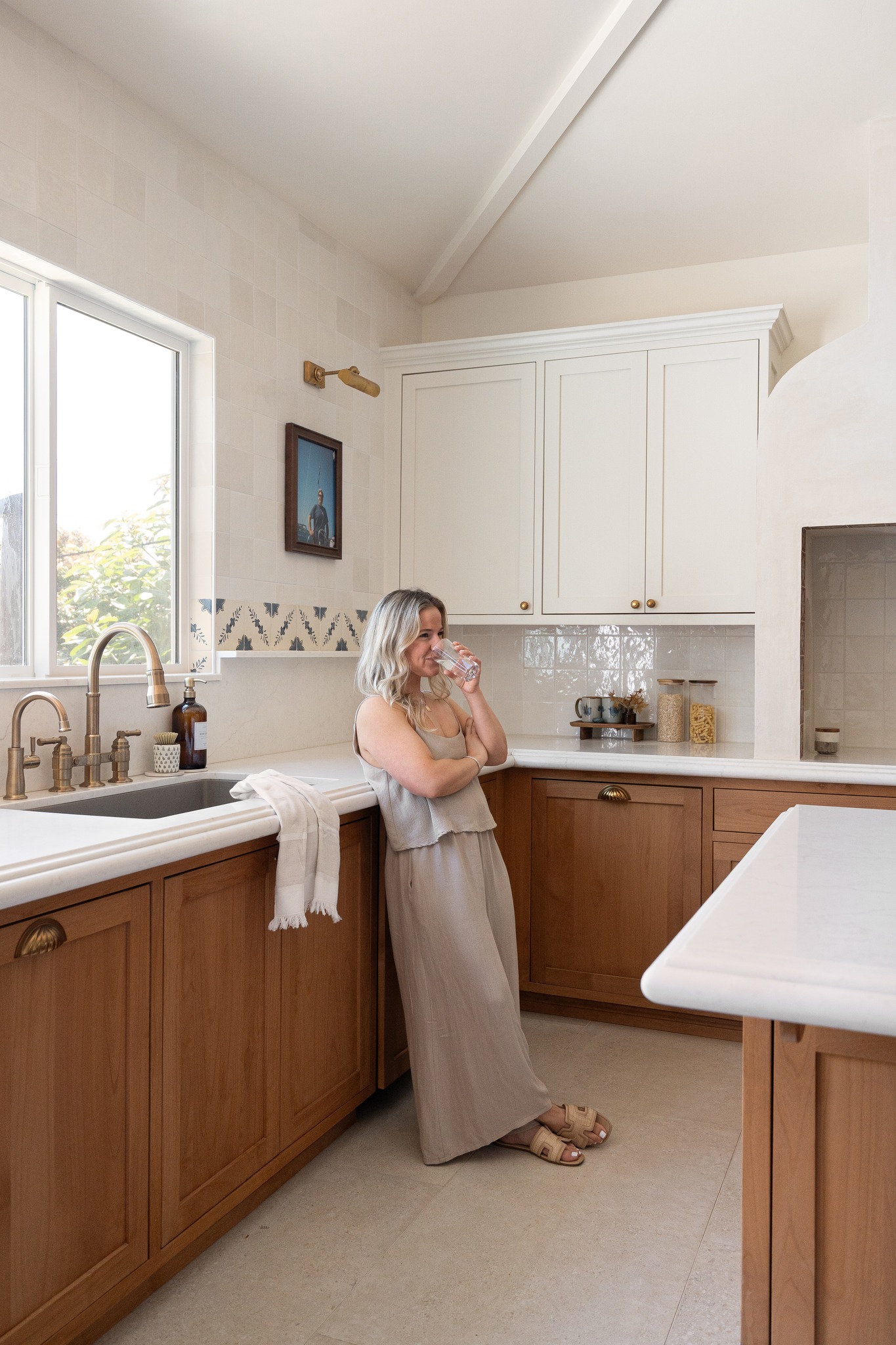 What I've learned after designing A LOT of spaces...
Every family lives differently.
What works beautifully for one homeowner may not work at all for another, which is why the best design solutions are never one-size-fits-all.
I've learned that the most successful homes aren't necessarily the biggest, the most expensive, or the most perfectly styled. They're the homes that truly support the people living in them.
In this particular project, one of my favorite details isn't something we designed at all. The photo behind me is a portrait of the homeowner's late father, from whom she inherited the home.
Sometimes the most meaningful pieces in a home aren't the ones that perfectly match, or are picked from a magazine. They're the ones that tell a story.
The homes that feel the most special are often the ones that reflect the people who live there, their memories, and the lives they've built within those walls.
At the end of the day, great design isn't about creating a perfect space. It's about creating the right space for the people who call it home 🤍
@noirandblancphoto