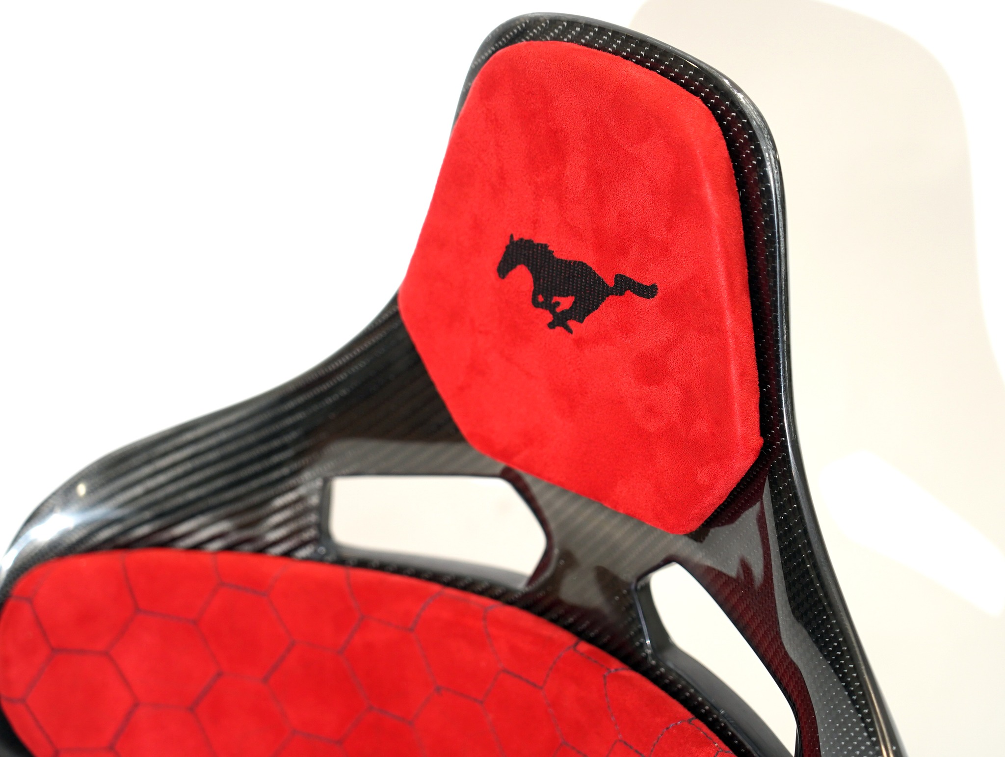 KevMannz GT-Max, full carbon fiber bucket seats, featuring vibrant red Alcantara padding, bold Mustang logo embroidery, and intricate honeycomb stitching - where performance meets limitless possibility! 💪