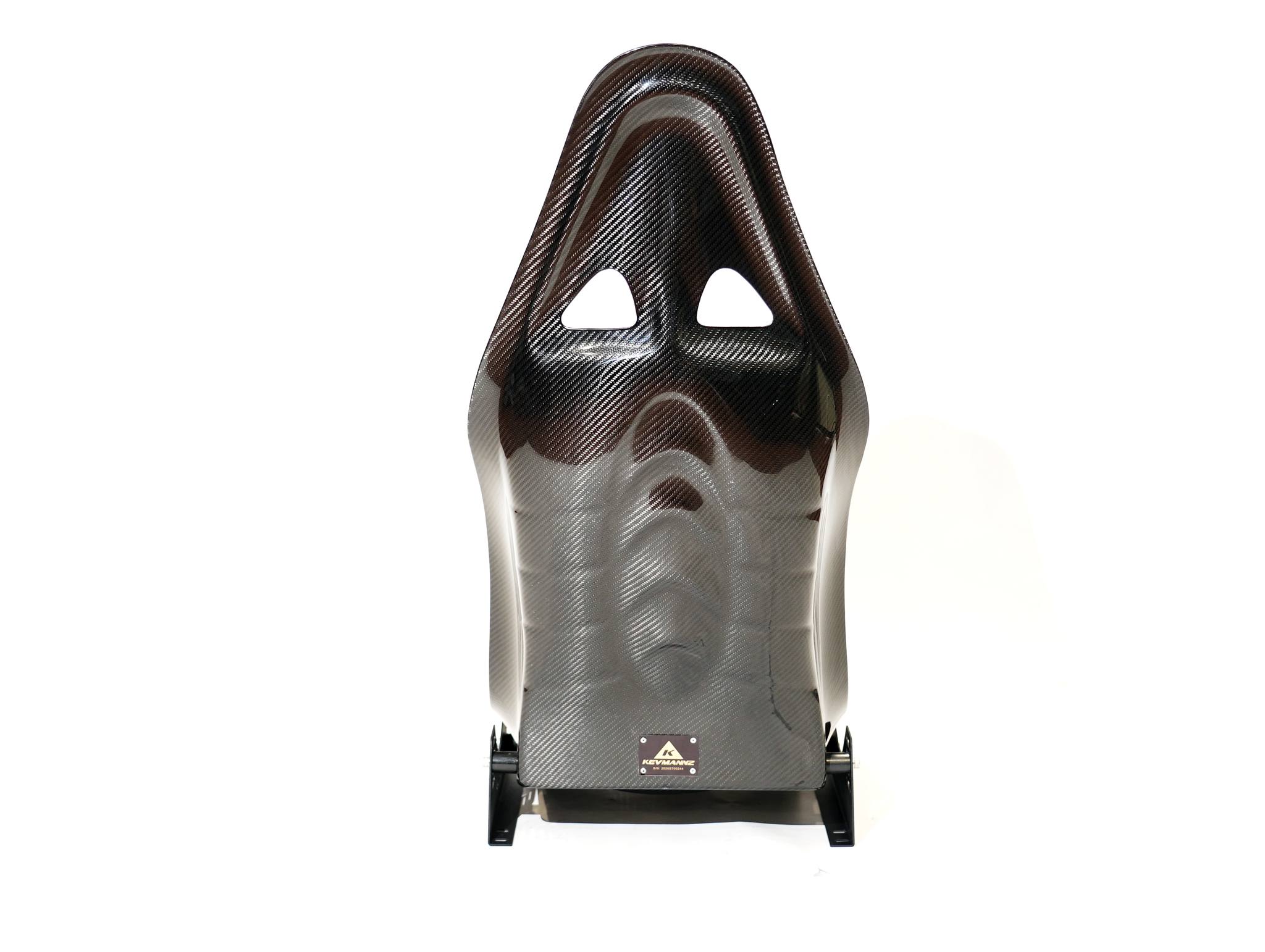 KevMannz full carbon fiber bucket seats V3, designed to fuel your passion and ignite your inner driving spirit. Featuring Corvette C7 (Z06) plug-and-play rails and slider kit, plus customized black Alcantara padding with a striking red diamond stitching pattern and Z06 logo on the headrest, these seats are the perfect catalyst for taking your driving to new heights.