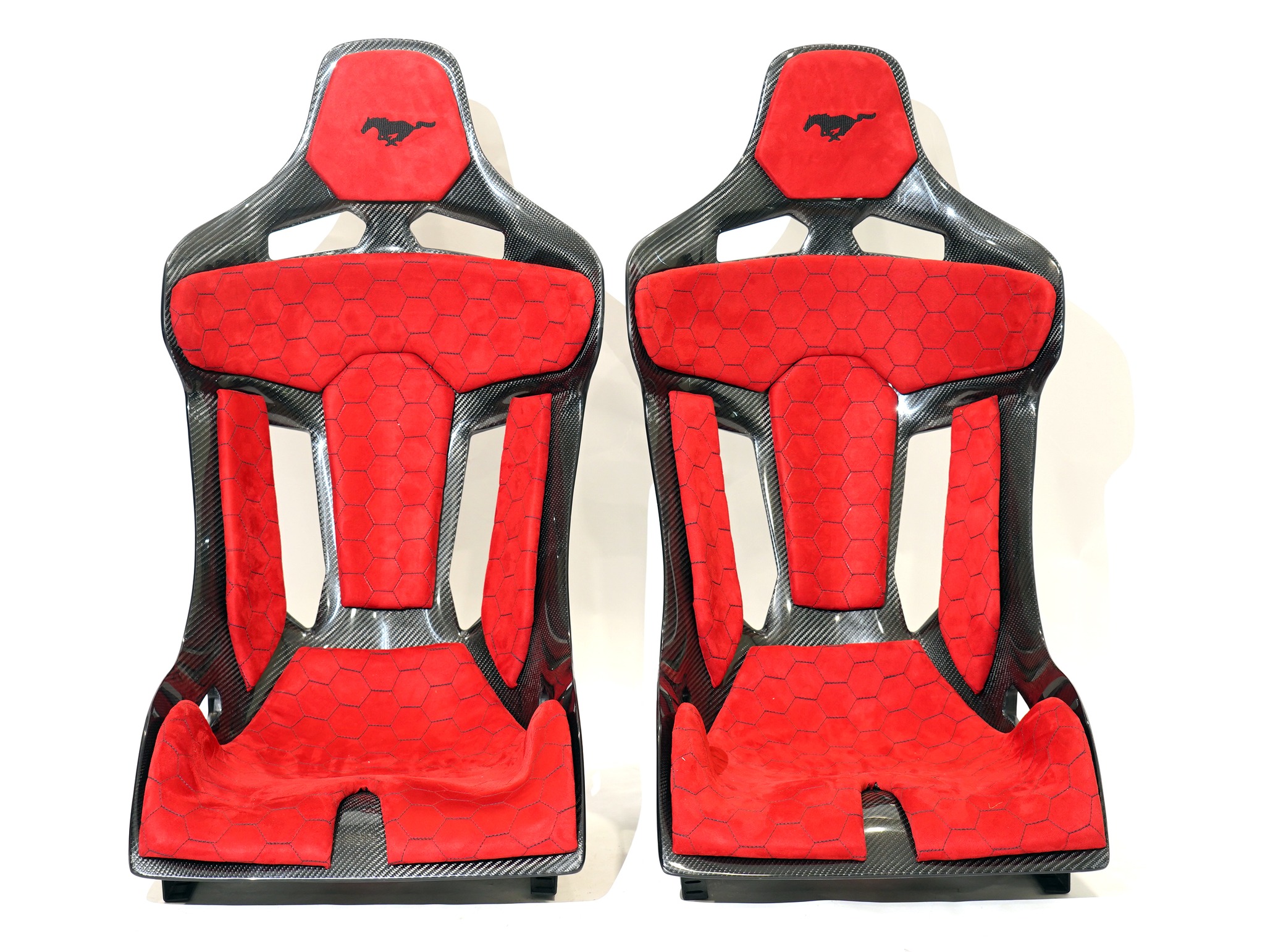 KevMannz GT-Max, full carbon fiber bucket seats, featuring vibrant red Alcantara padding, bold Mustang logo embroidery, and intricate honeycomb stitching - where performance meets limitless possibility! 💪
