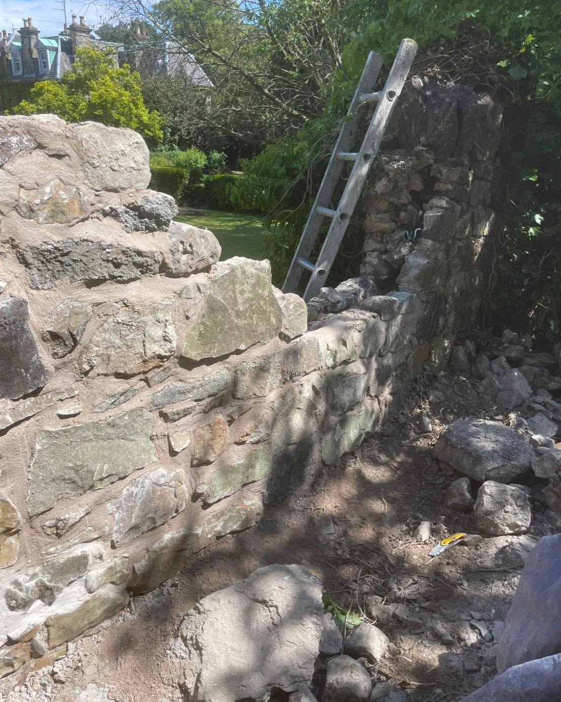 Damaged wall areas rebuilt and repointed with lime mortar around property — Stirling