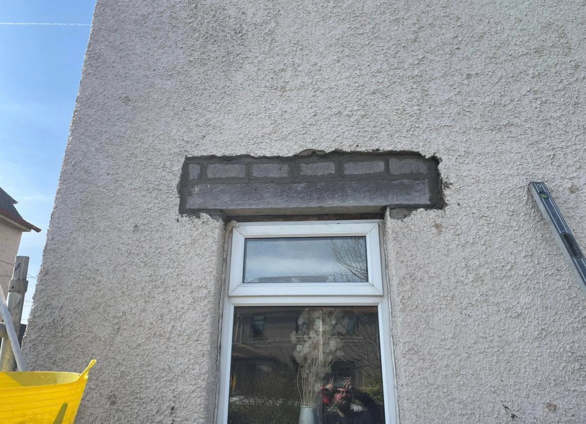 Front and back elevation defective window lintels being replaced and roughcasted — Motherwell