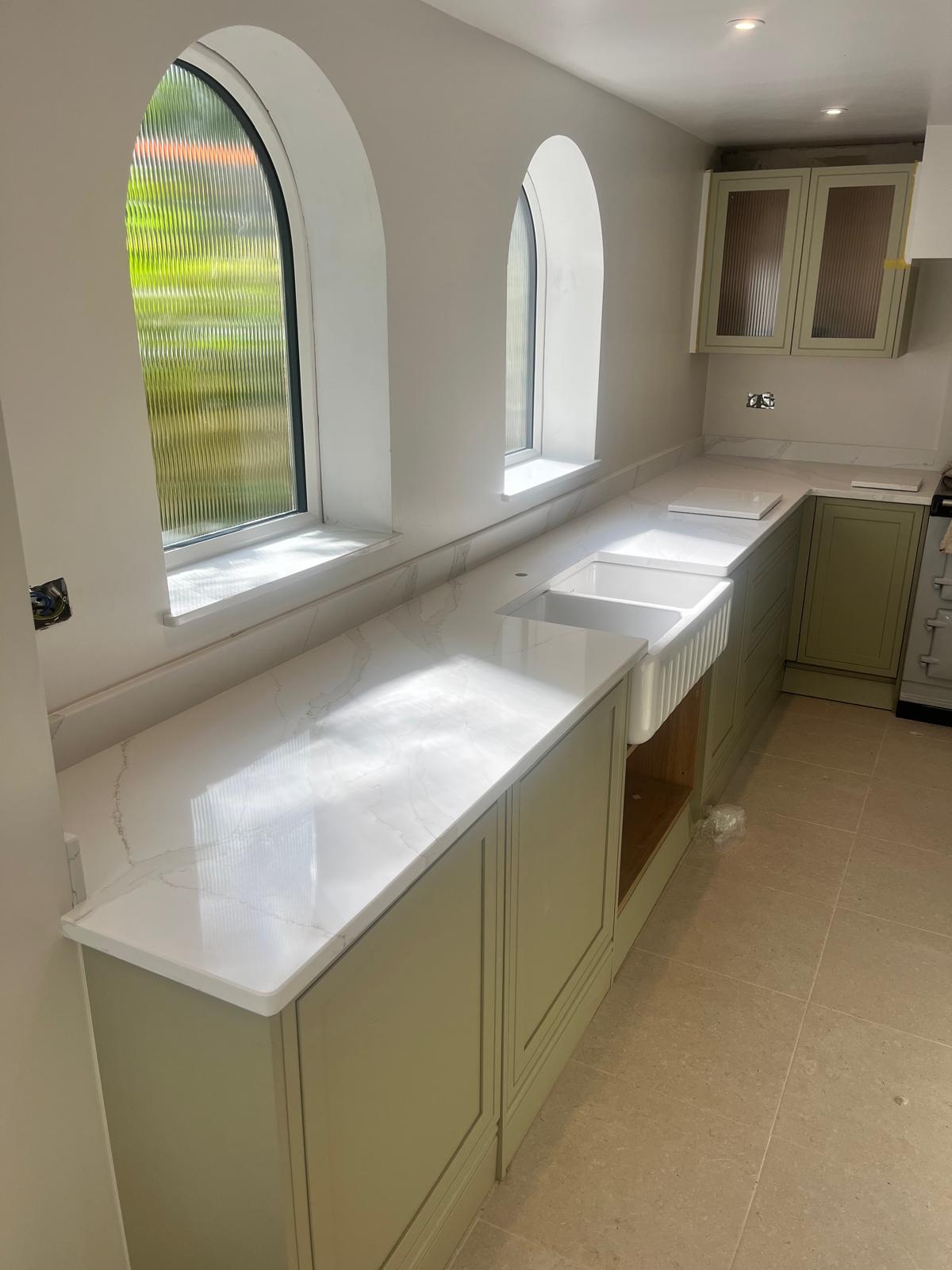 Qstone Calacatta Oro worktops with mitred breakfast bar waterfall end panel, upstands and splashbacks, pantry tops and window sills, fitted in Stoke #homeimprovement #kitchenideas #quartzworktops #worktopscheshire #quartzworktop #kitchenworktops