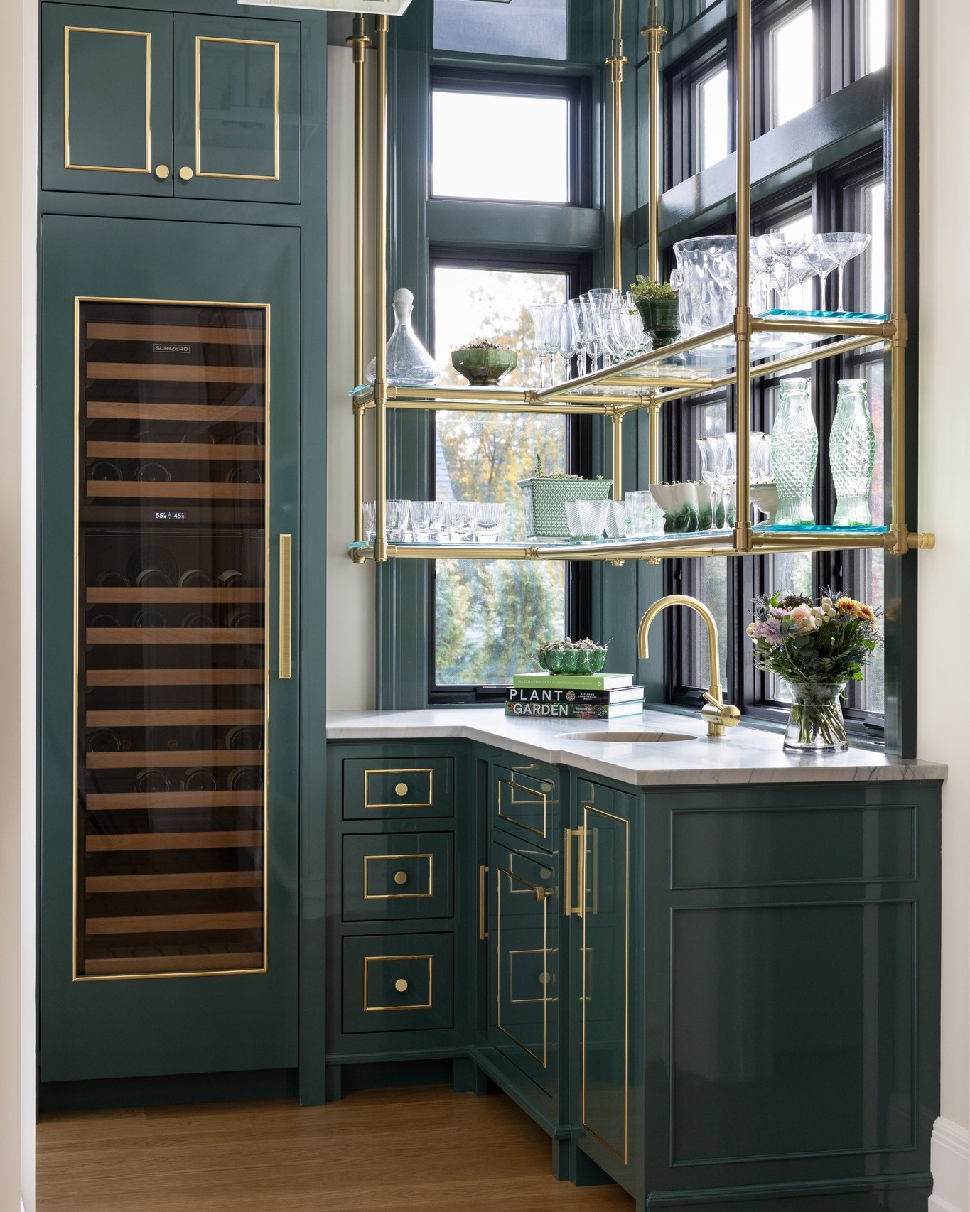 Rich green cabinetry and precise brass detailing give this compact space an unmistakably custom feel. From the integrated wine storage to the tailored cabinet fronts and trim work, the millwork was designed to make every inch feel intentional.
Cabinetry: Fallon Fine Cabinetry
Interior Designer: @tastedesigninc
Photographer: @emilyobrienphoto_design
Architect: @slocumhalldesign
#ButlersPantry #CustomCabinetry #CustomMillwork #LuxuryKitchen #LuxuryInteriors #GreenCabinetry #CabinetryDesign #ArchitecturalMillwork #BespokeInteriors #LuxuryHomeDesign #CustomHomes #KitchenInspiration #InteriorDetails #FineWoodworking #HomeBarDesign #PantryDesign #CustomBuilder #MassachusettsBuilder #NewEnglandHomes #InteriorInspiration