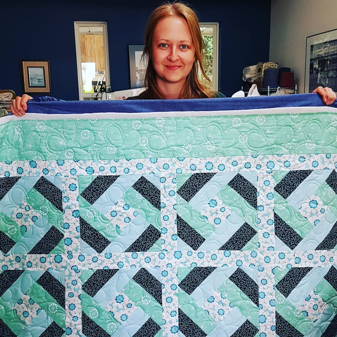 Meet my new apprentice, my daughter Tianna. Today was her first day learning how to use the computerized longarm and the Quilt Path program and she did a fantastic job!! The top is one I made using a block pattern by Lorraine Mooney. Tianna quilted it with an edge to edge pantograph called "Daisy Dots". This quilt is a charity quilt and it will eventually find its way to a local women's transition house.
#quiltingismypassion #longarmquilter #quiltersinvictoriabc #canadianquilter #quiltersofinstagram #ilovemydaughter #quiltersgottaquilt #quilting #apqsmillie30 #quiltpath #lorrainemooney #charityquilt #charitystartsathome #mistymountainstudio #onlinefabricstore #thebatikplace #mistymountainvictoriadotcom