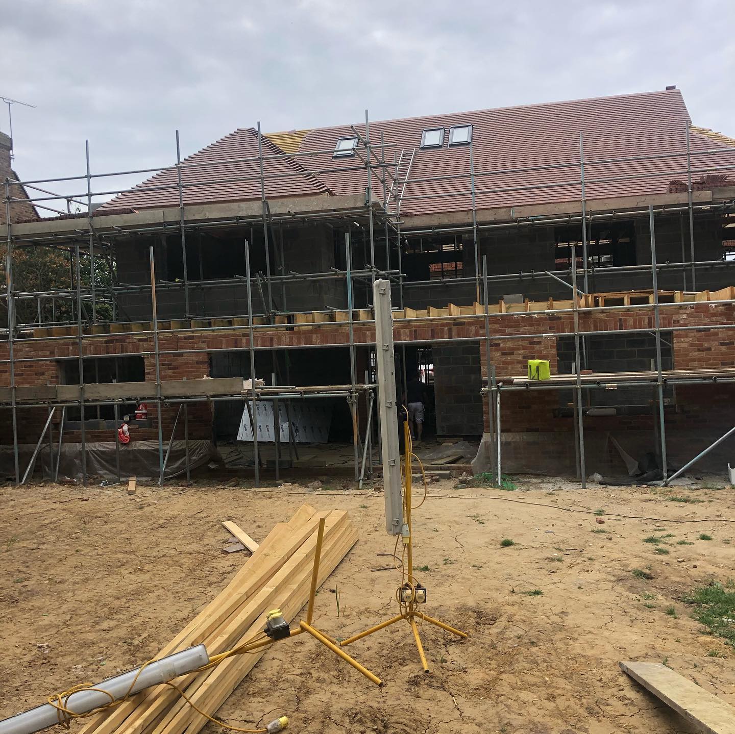 Velux windows going in and clay tiles going down along with valley tiles and bonnets