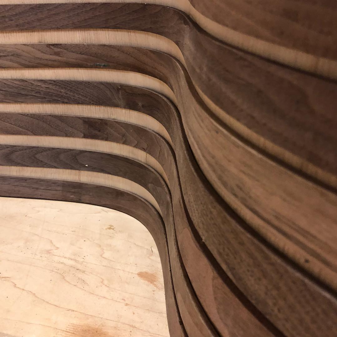 Making fluid organic curves from solid hardwood. #walnut #furnituredesign #molding #steambending #wallpaper #finewoodworking #hardwood #organic #vancouverdesign #idswest #architecture #design