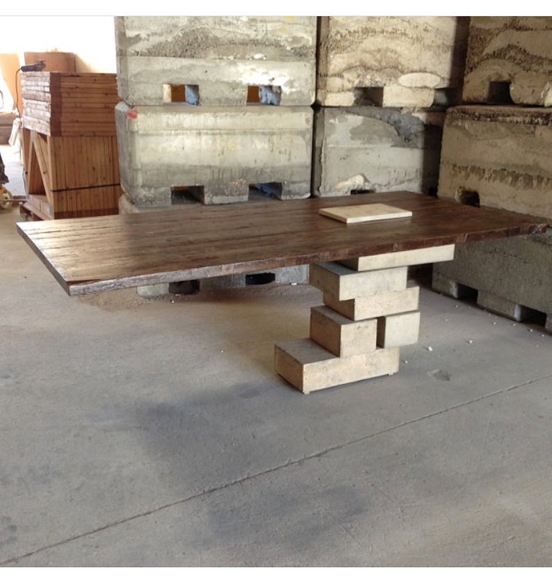 2012 retrospective. The original concept was to imagine how the first table might have been built. Place a relatively flat piece of wood on top a few stones and boom! you have a table.