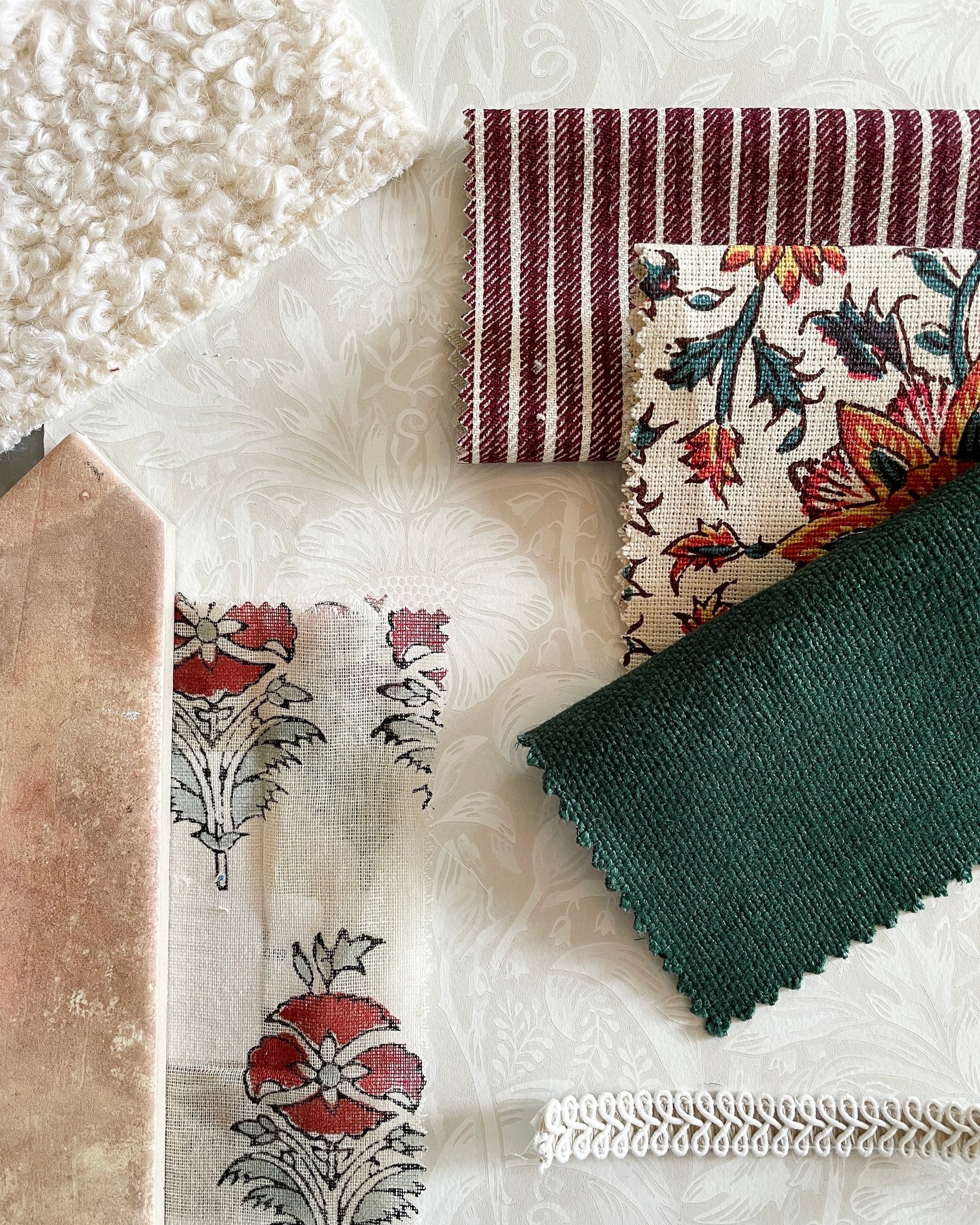 The secret to creating a balanced material aesthetic is finding the perfect blend of fabrics, patterns, and textures. When working with clients, we typically start with a fabric we can't live without and then build a thoughtfully layered look from there.
I love to experiment with unexpected patterns, hues, and scale to create depth and visual interest and, in my opinion, there's nothing that isn't made better with a stripe!